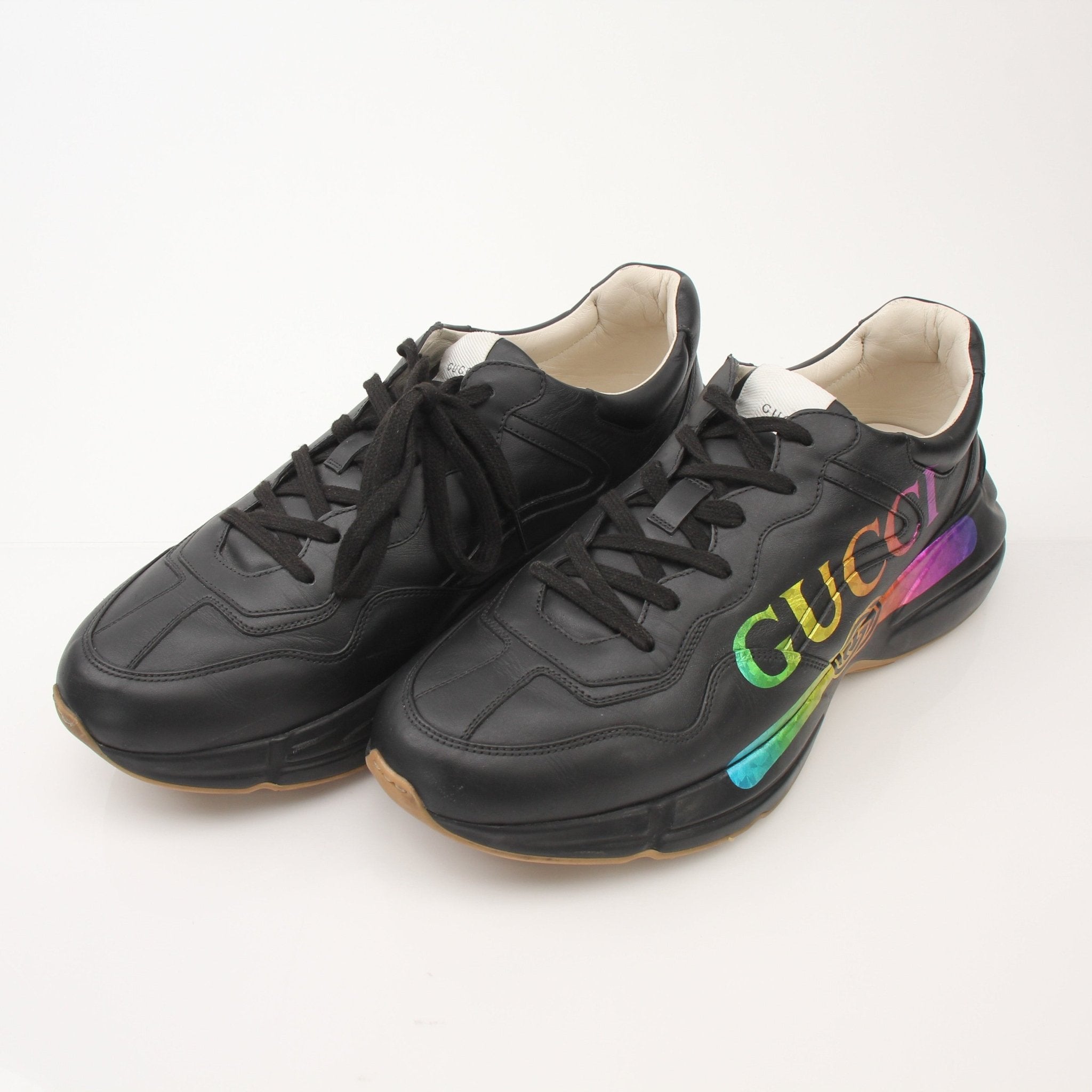 Gold & Beyond iridescent logo sneakers for men featuring a stylish Gucci Rython shoe design with reflective finish and sporty look.