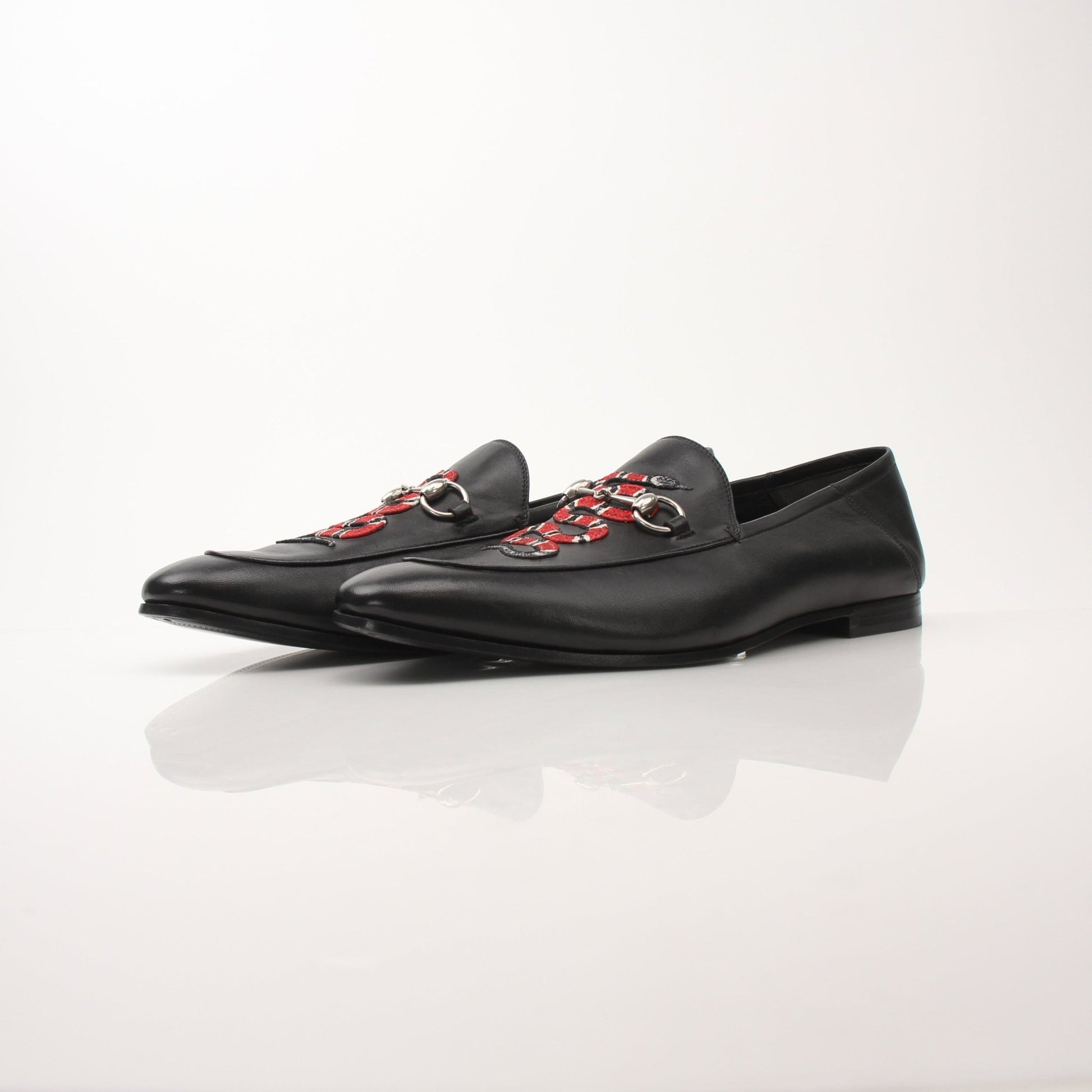 Gold & Beyond men's Gucci King Snake loafers showing detailed snake-print leather shoes with classic loafer design.