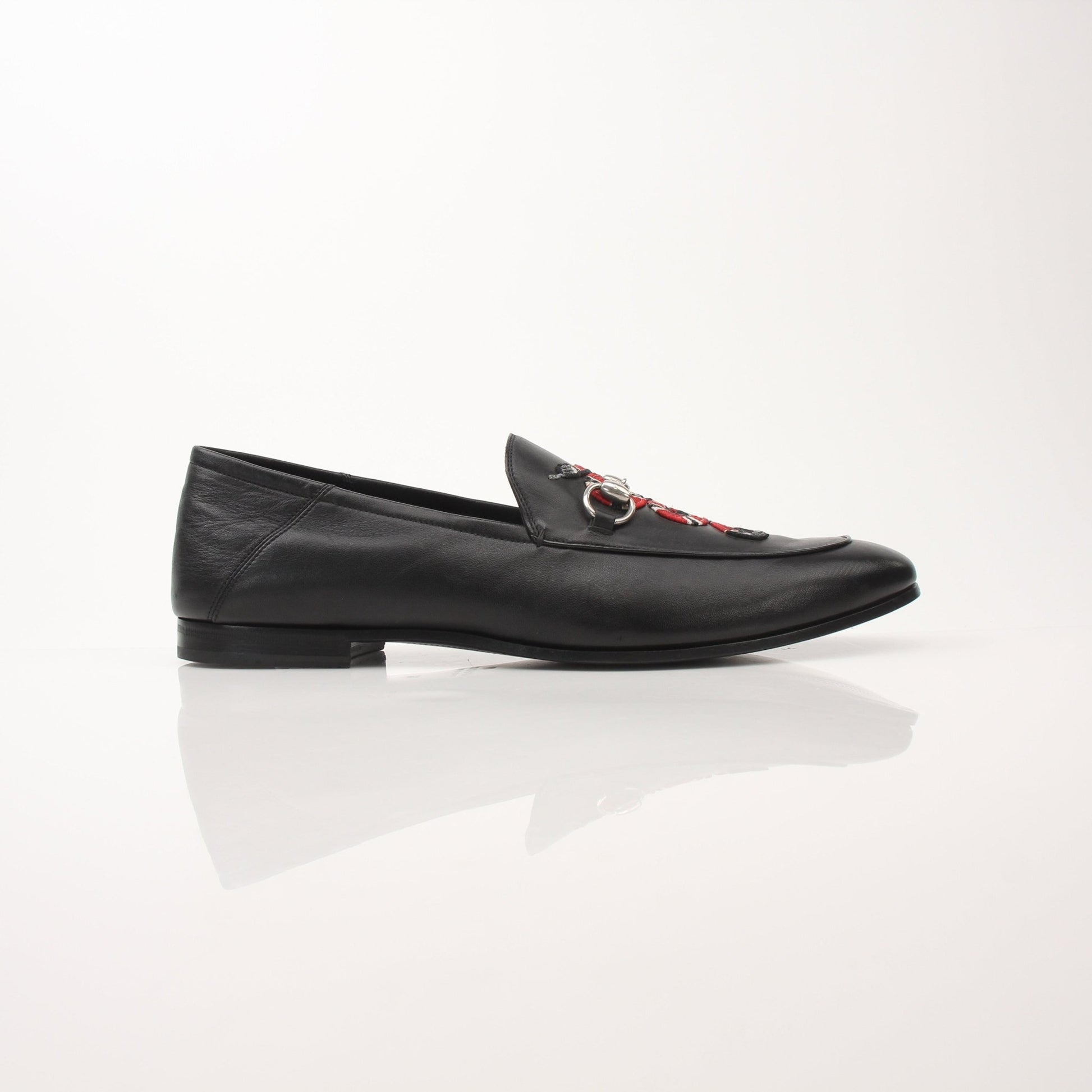 Gold & Beyond Gucci Men’s King Snake Loafers shoes with snake print design and sleek leather finish.
