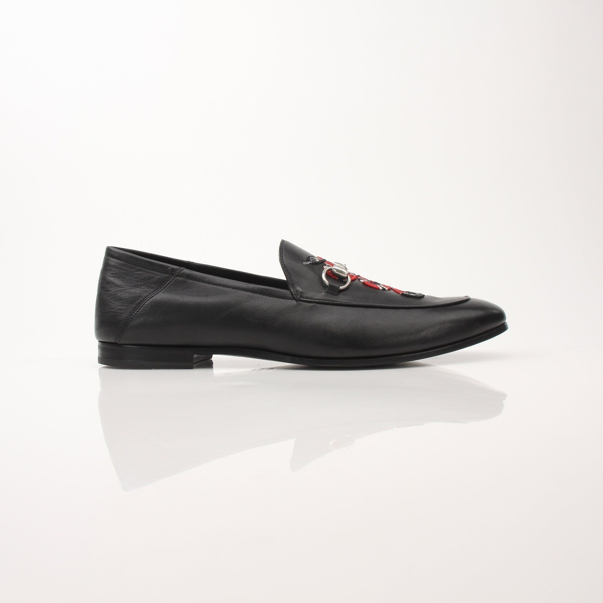Gold & Beyond Gucci Men’s King Snake Loafers shoes with snake print design and sleek leather finish.