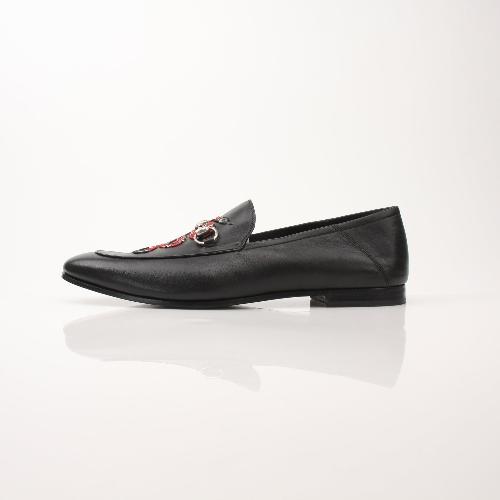 Gucci Men’s King Snake Loafers in black leather with gold-tone snake detail and classic slip-on design, stylish men's shoes.