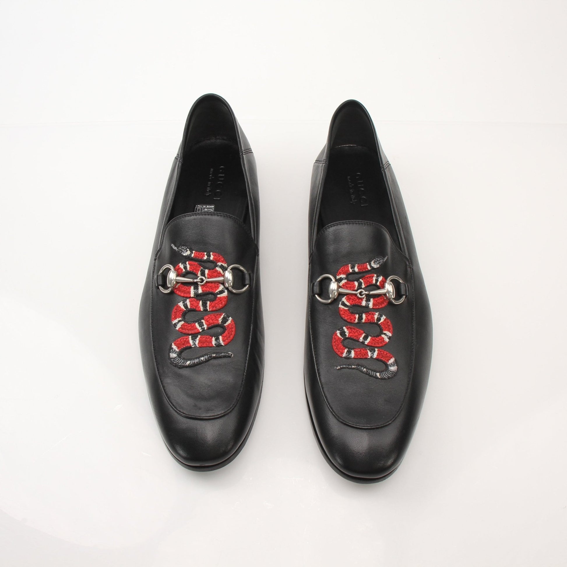 Gold & Beyond Gucci men's King Snake loafers, stylish leather shoes with snake-embossed design, casual slip-on footwear.