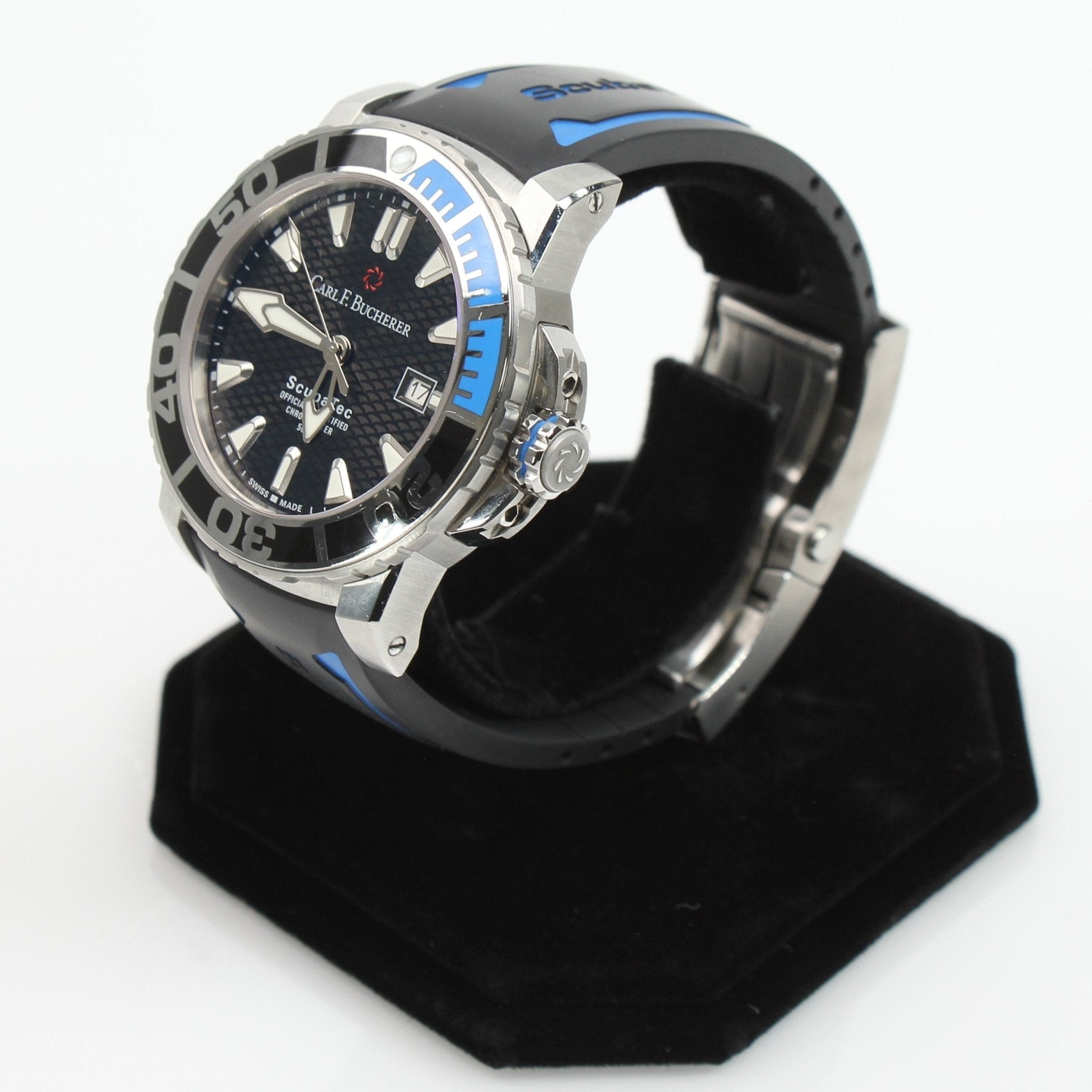 Carl F. Bucherer ScubaTec diver watch with black dial, stainless steel case, and rotating bezel, shown on a wrist.