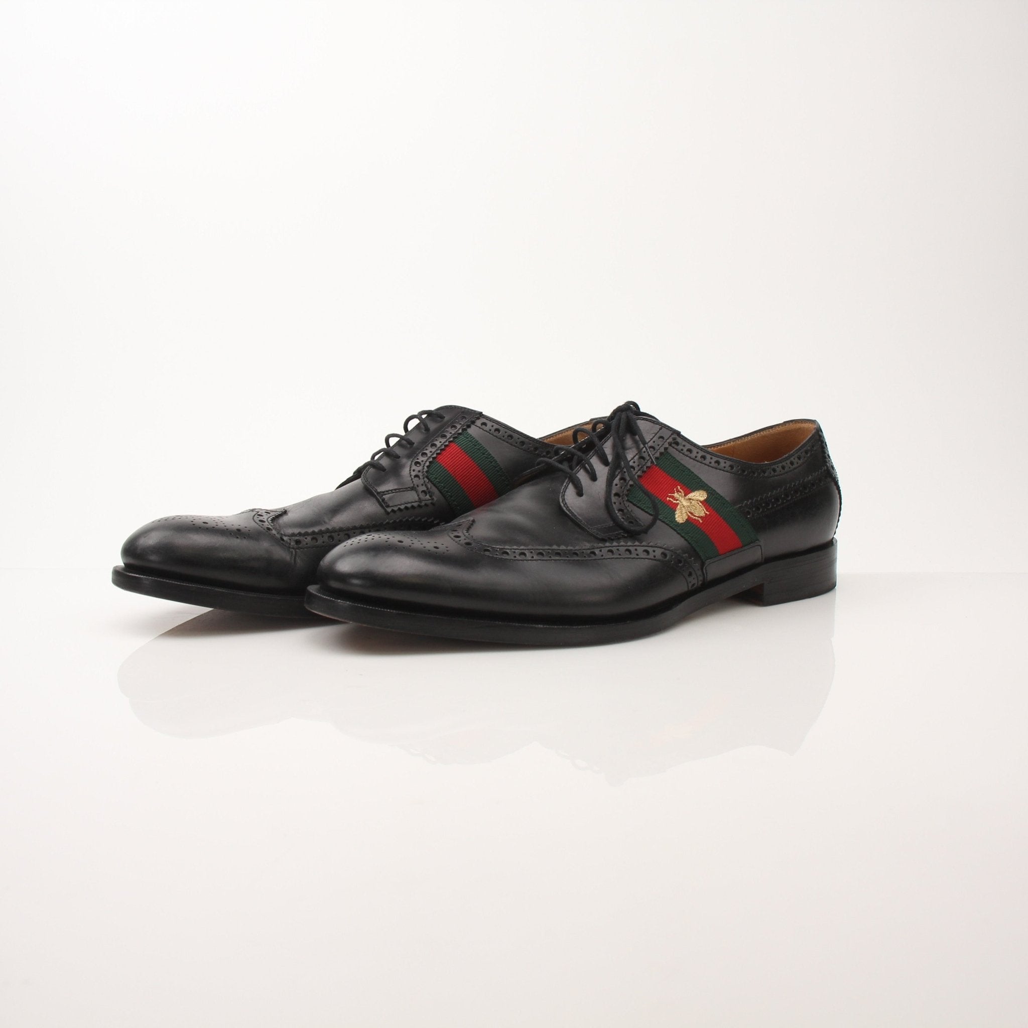 Gold & Beyond Gucci men’s Bee Web Derby shoes featuring leather uppers and intricate web detailing in a stylish shoe design.