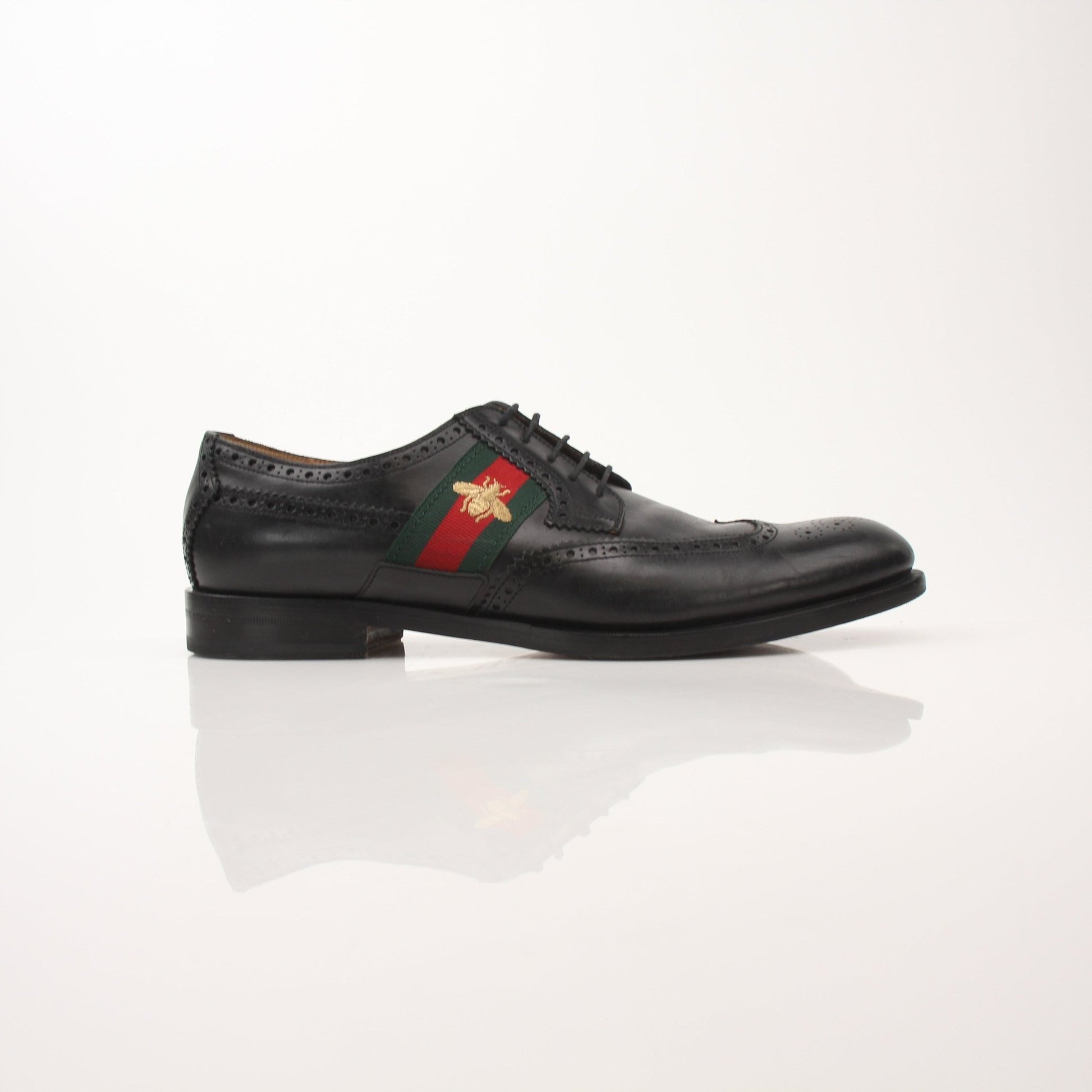 Gold & Beyond Gucci men’s Bee Web Derby shoes showing detailed leather with bee and web pattern design