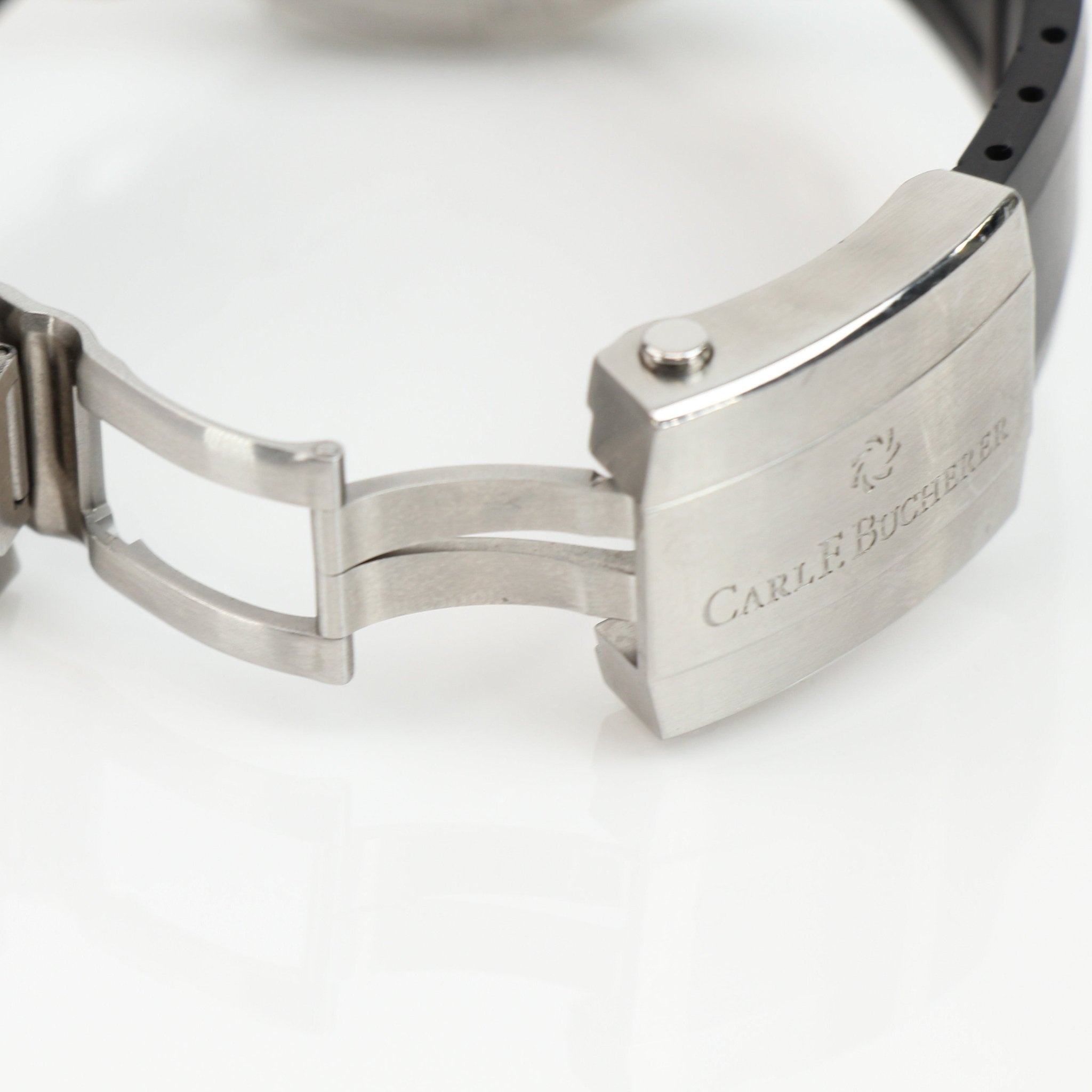 Carl F. Bucherer ScubaTec diver watch with black dial, stainless steel case, and sporty design, shown on a wrist.