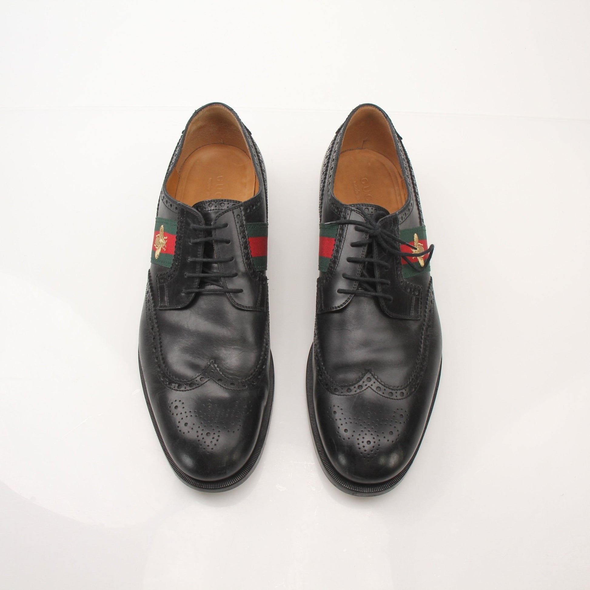 Gold & Beyond Gucci Men’s Bee Web Derby Shoes showing detailed leather shoes with bee web pattern and classic lace-up design.