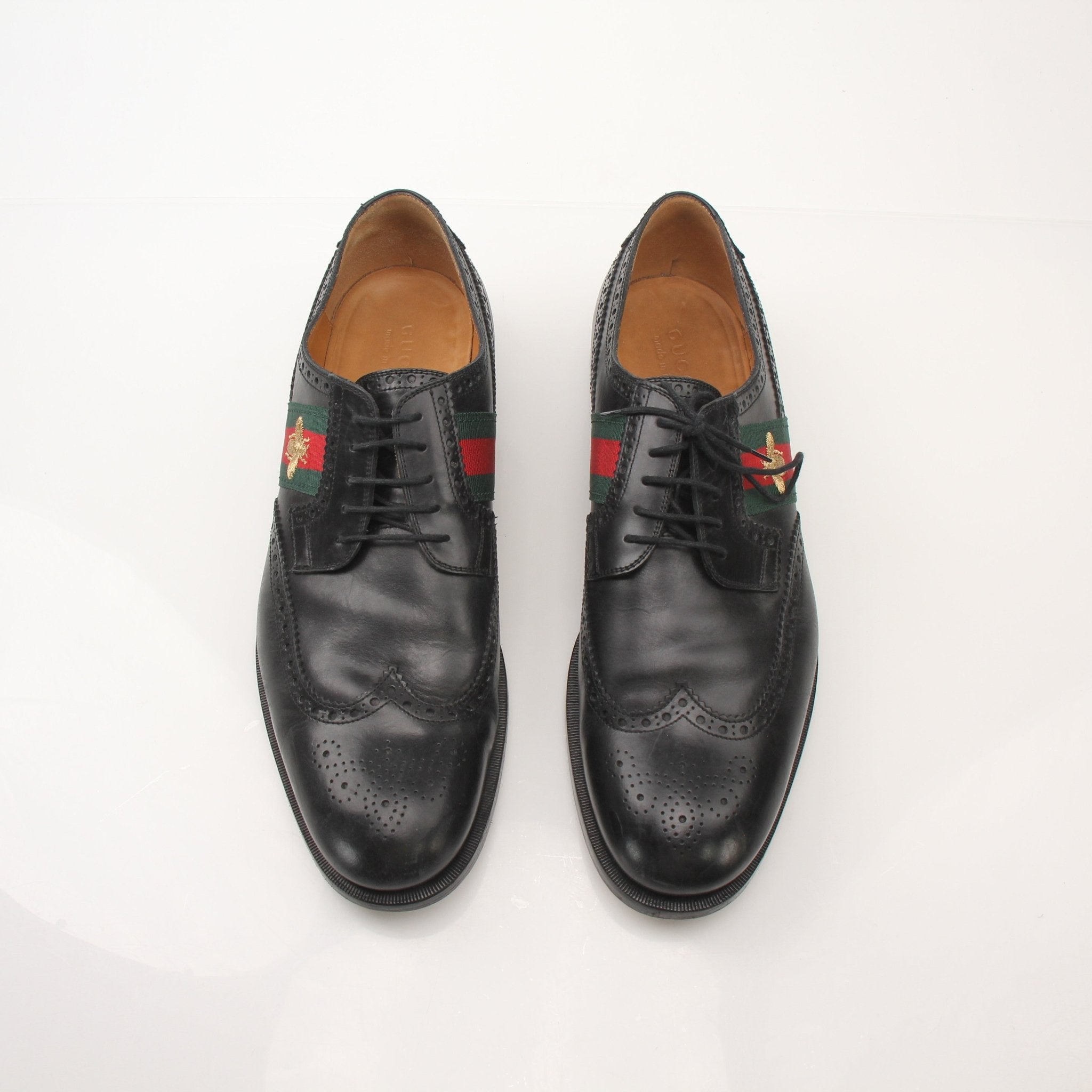 Gold & Beyond Gucci Men’s Bee Web Derby Shoes showing detailed leather shoes with bee web pattern and classic lace-up design.