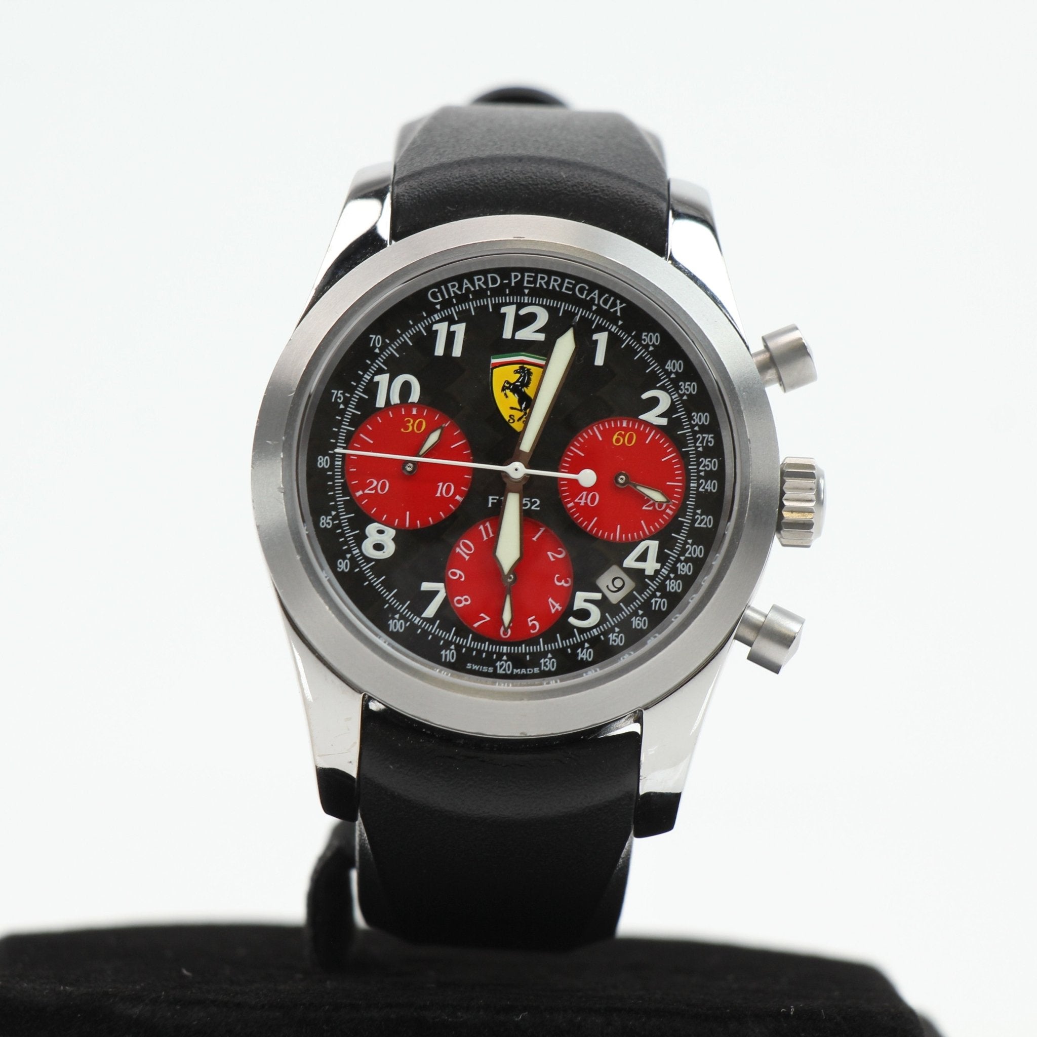 Girard-Perregaux Ferrari chronograph watch with stainless steel case and black leather strap, detailed dial, and sporty design.