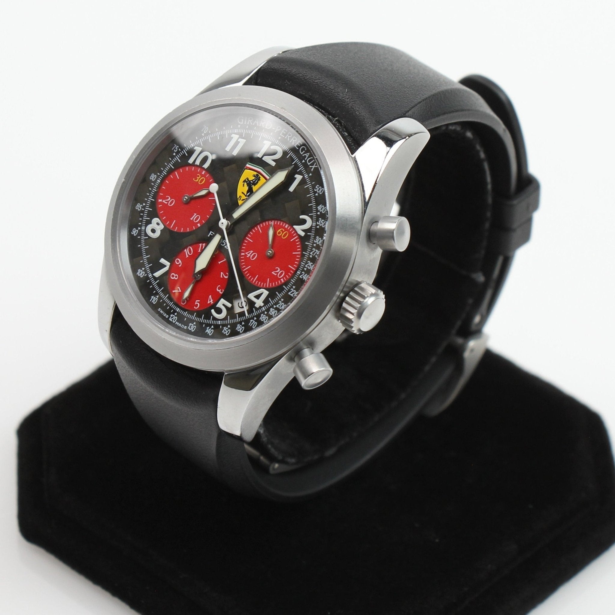 Girard-Perregaux Ferrari Chronograph watch with black dial, silver case, and leather strap, showcasing luxury watch design.