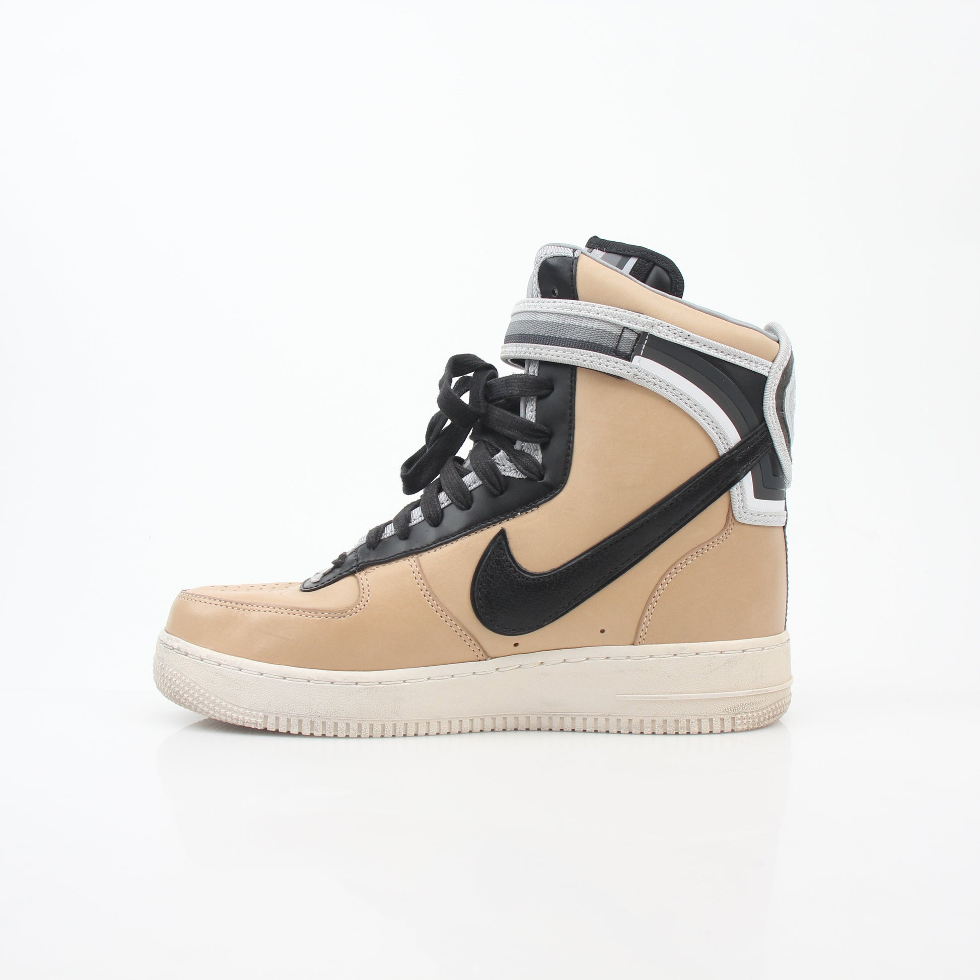 Nike x Riccardo Tisci Tan Air Force 1 High SP sneakers in natural tan leather with logo accents and high-top design.