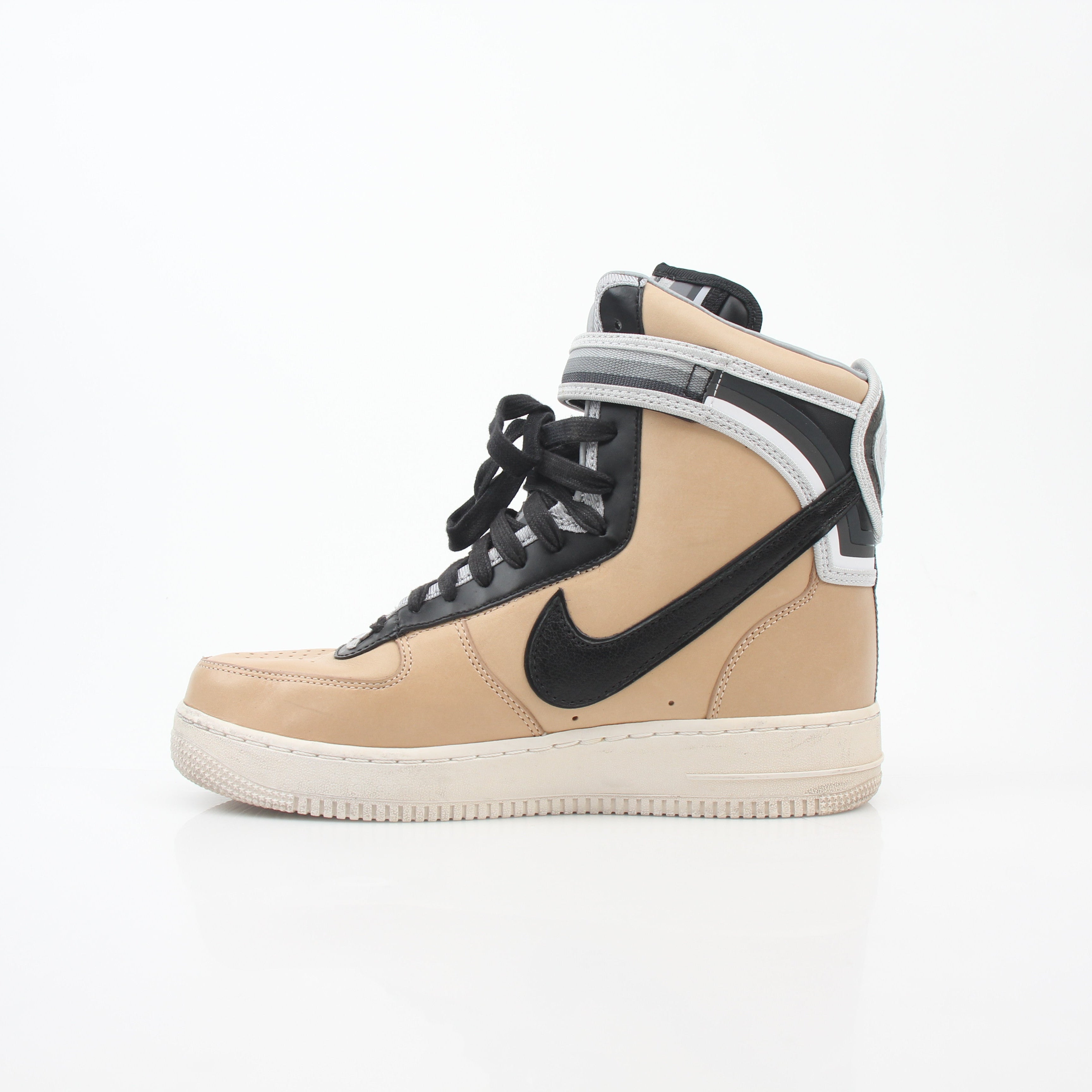 Nike x Riccardo Tisci Tan Air Force 1 High SP sneakers in natural tan leather with logo accents and high-top design.