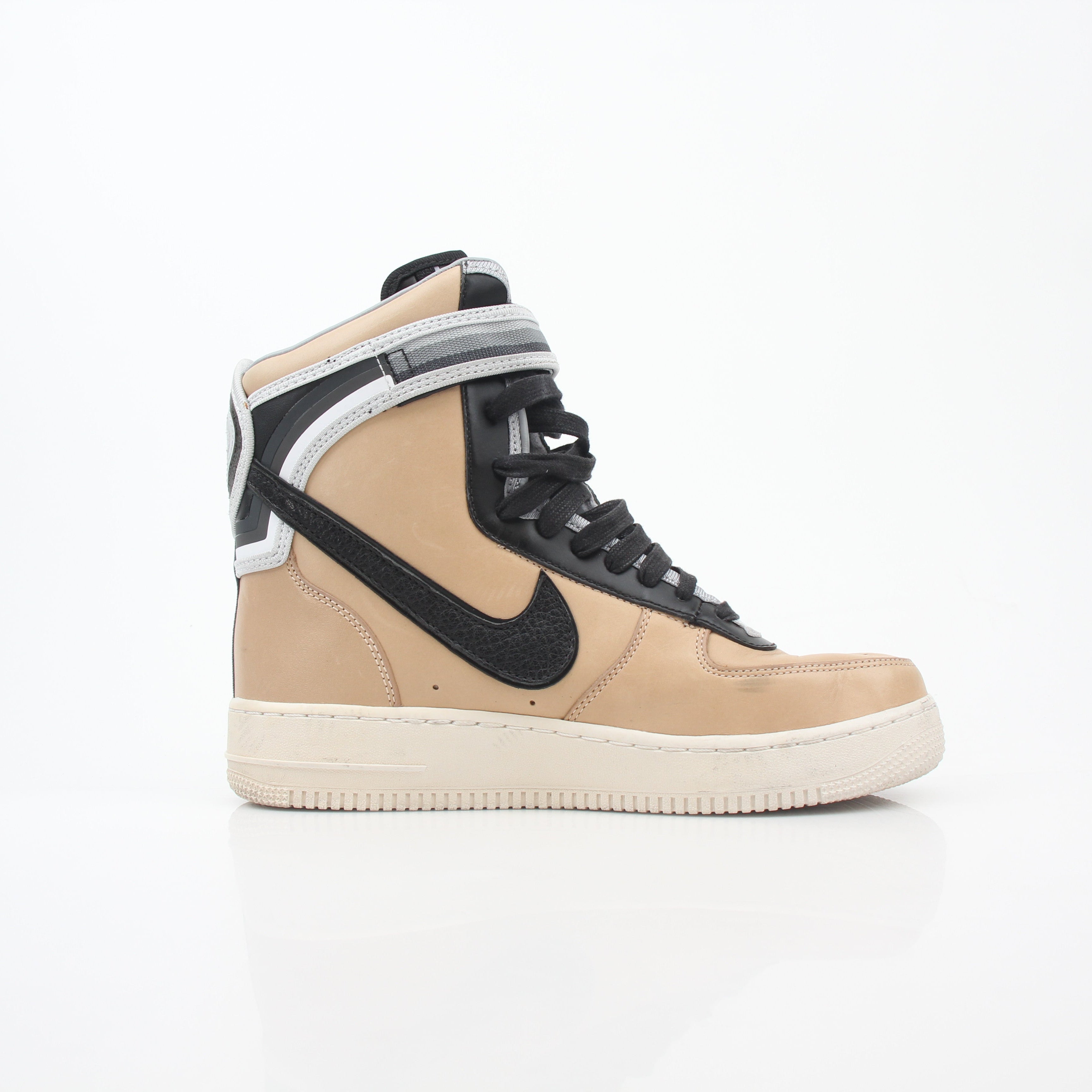 Nike x Riccardo Tisci Tan Air Force 1 High SP sneakers, in tan leather with Nike branding and high-top design.