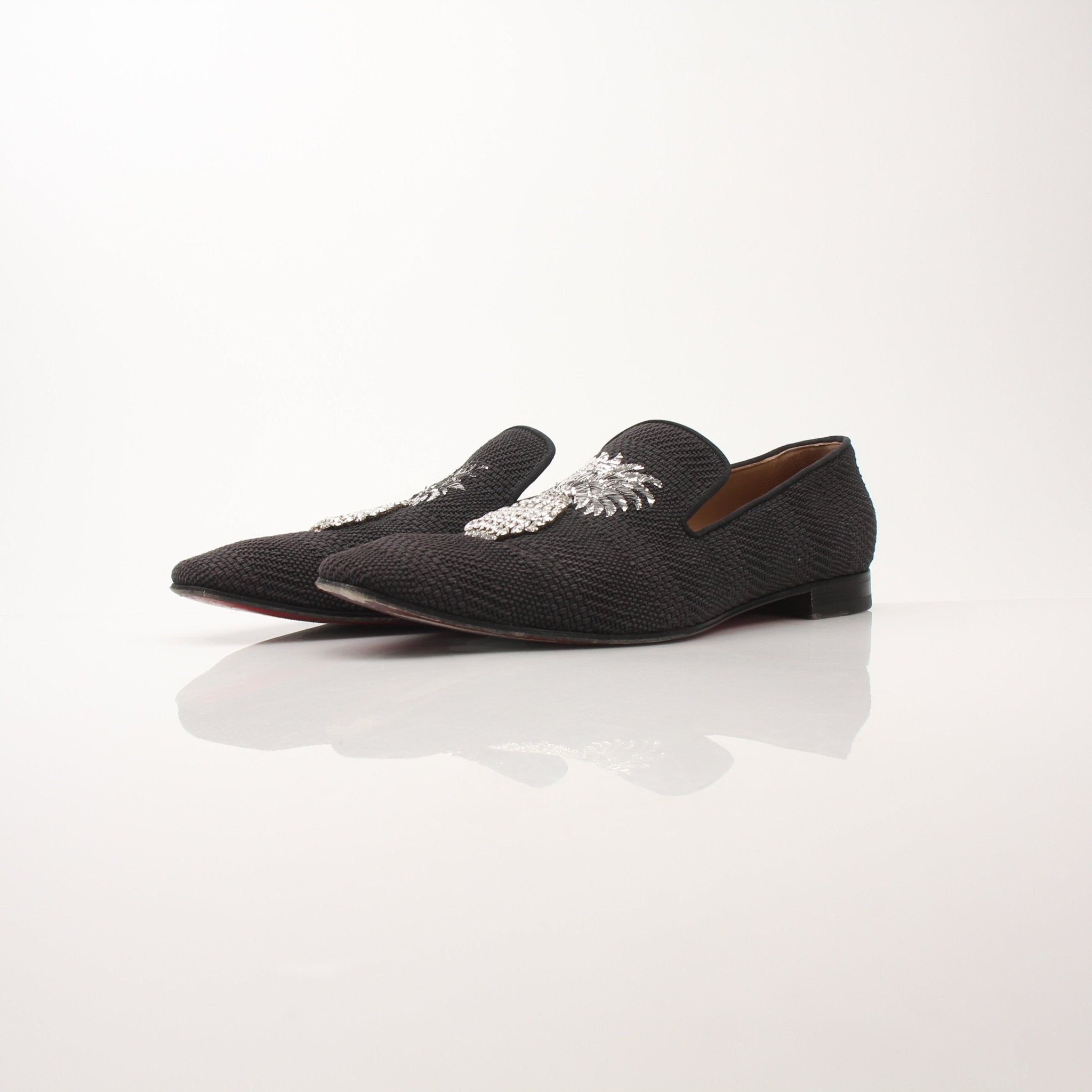 Christian Louboutin men's Dandanas crystal-embellished loafers with sleek design and luxurious detailing, displayed in a product image.