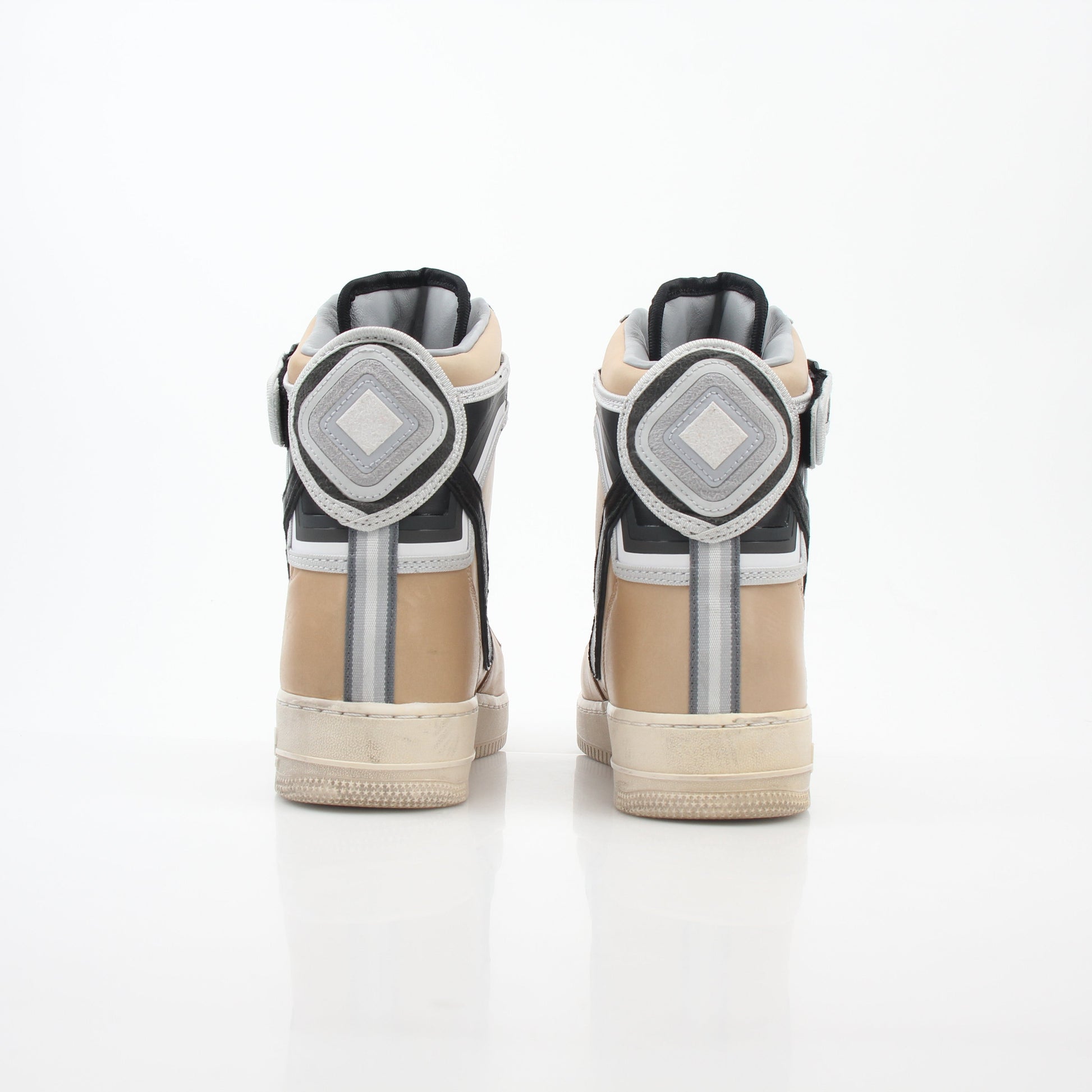 Nike x Riccardo Tisci Tan Air Force 1 High SP sneakers, gold and beige shoes with Nike branding and high-top design.