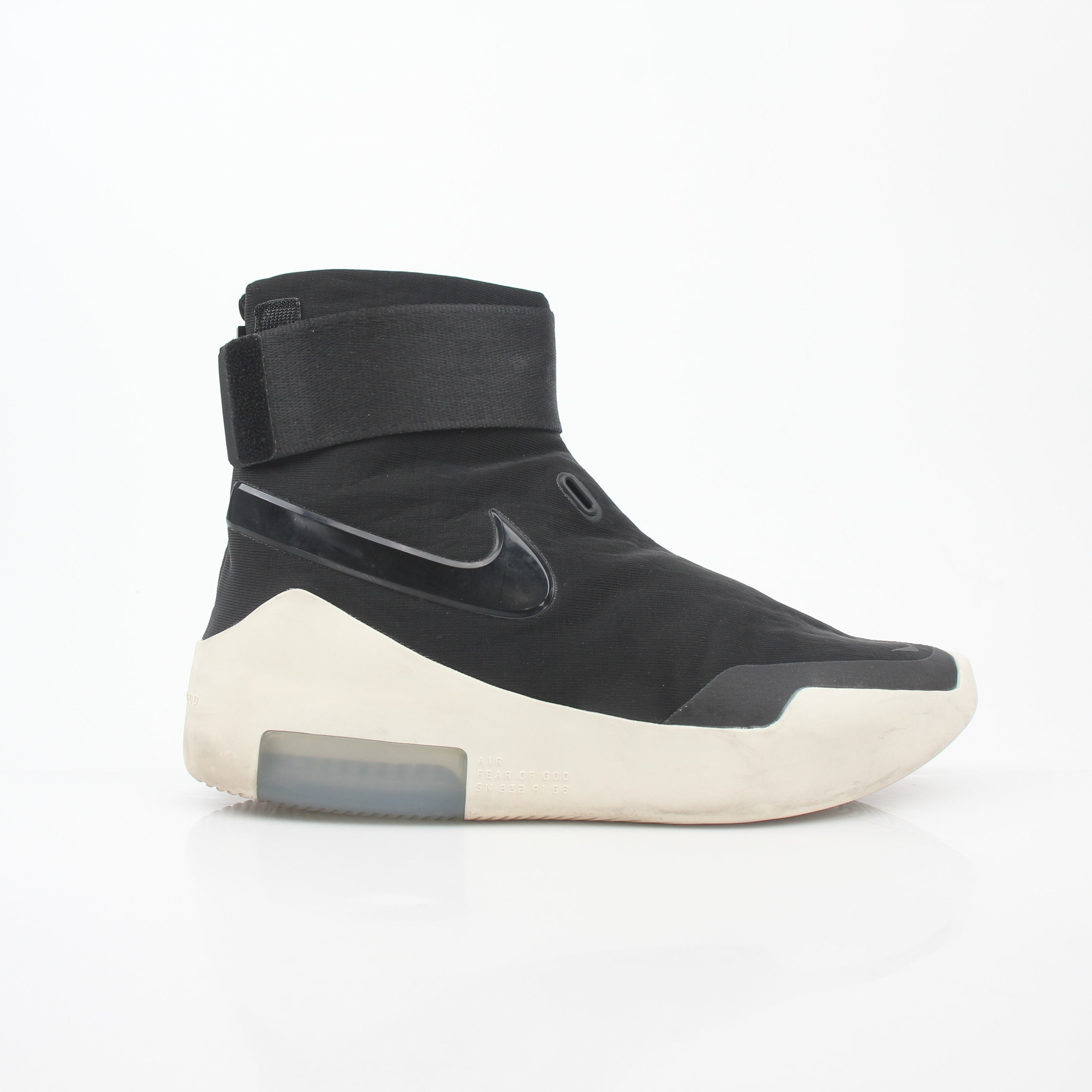 Black Nike x Fear of God Air Fear of God 1 high-top sneakers with Nike branding and sleek design, styled on a plain background.