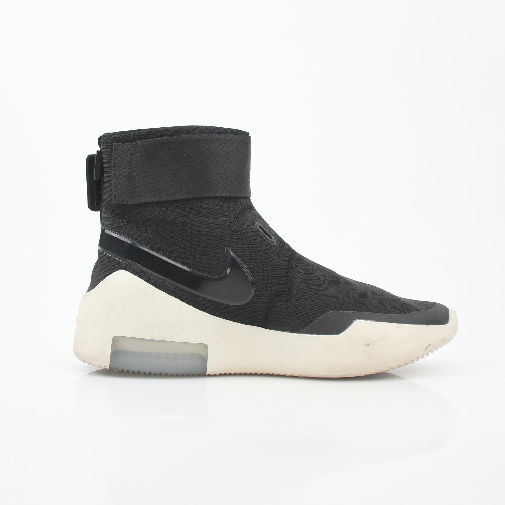 Black Nike x Fear of God Air Fear of God 1 high-top sneakers with Nike branding and sleek design, worn on feet.