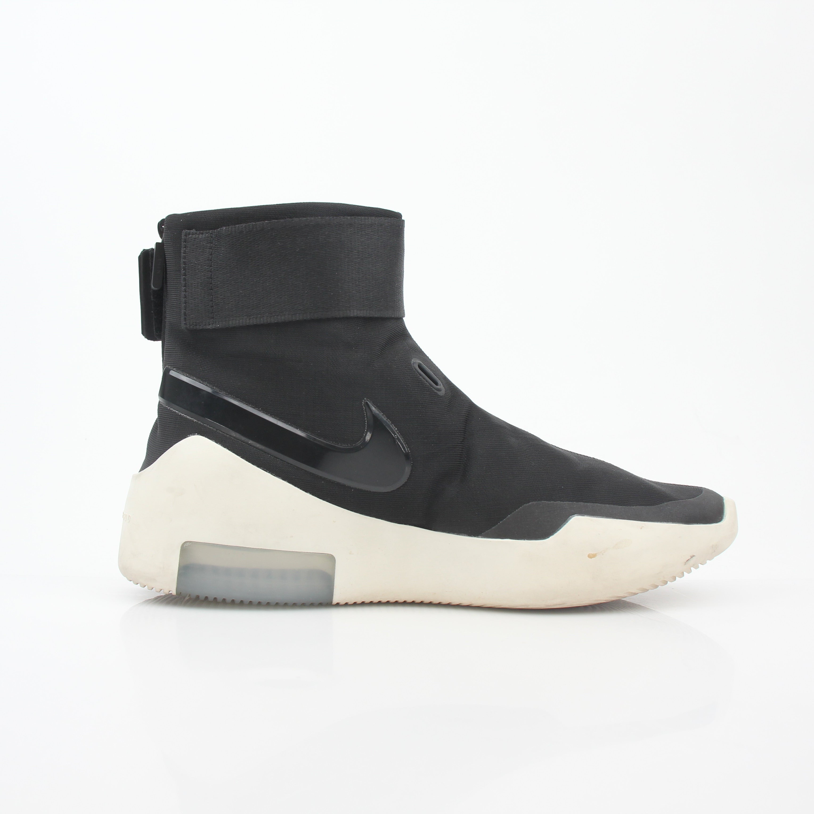 Black Nike x Fear of God Air Fear of God 1 high-top sneakers with Nike branding and sleek design, worn on feet.