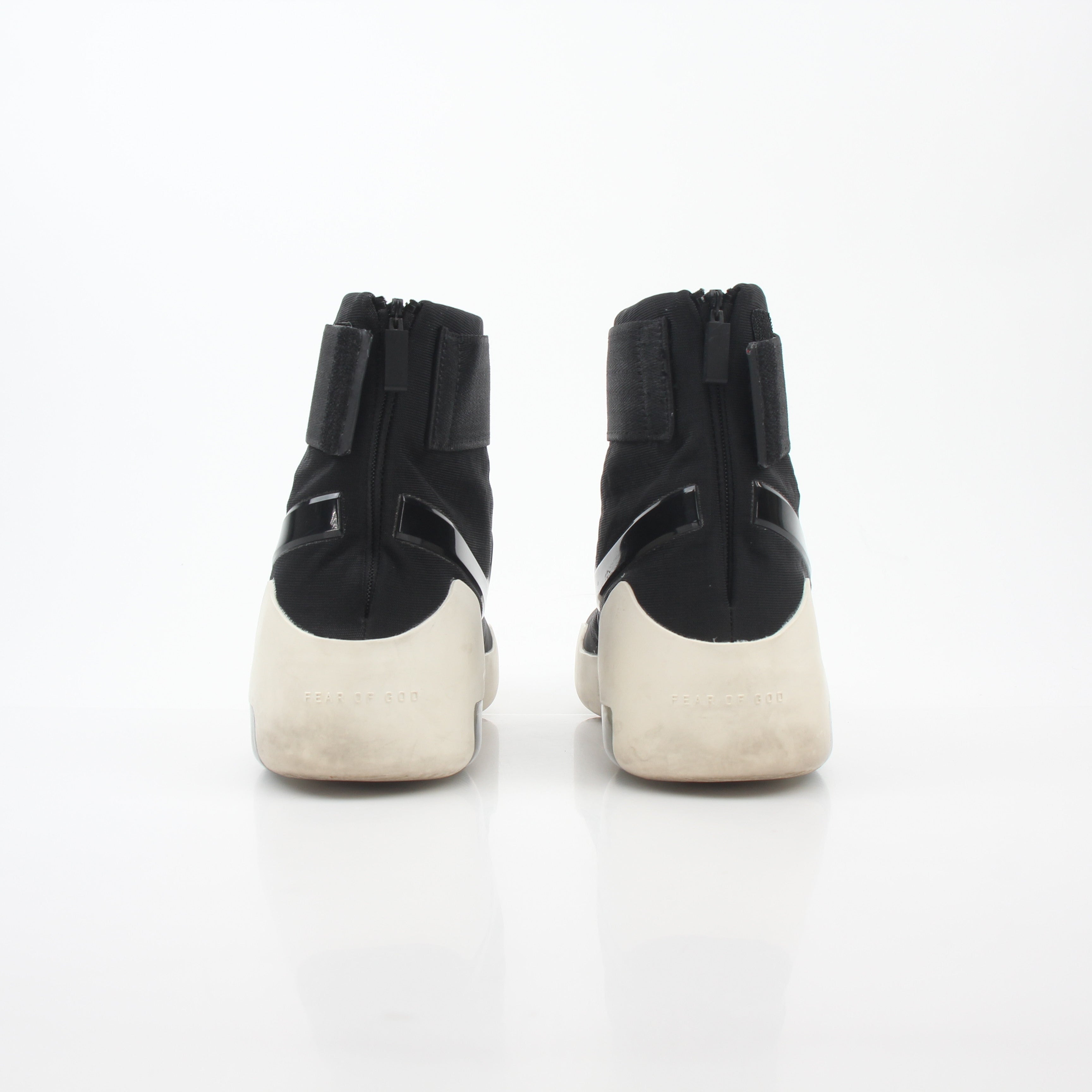 Nike x Fear of God black Air Fear of God 1 high-top sneakers, showing the sleek design and premium details of the shoes.