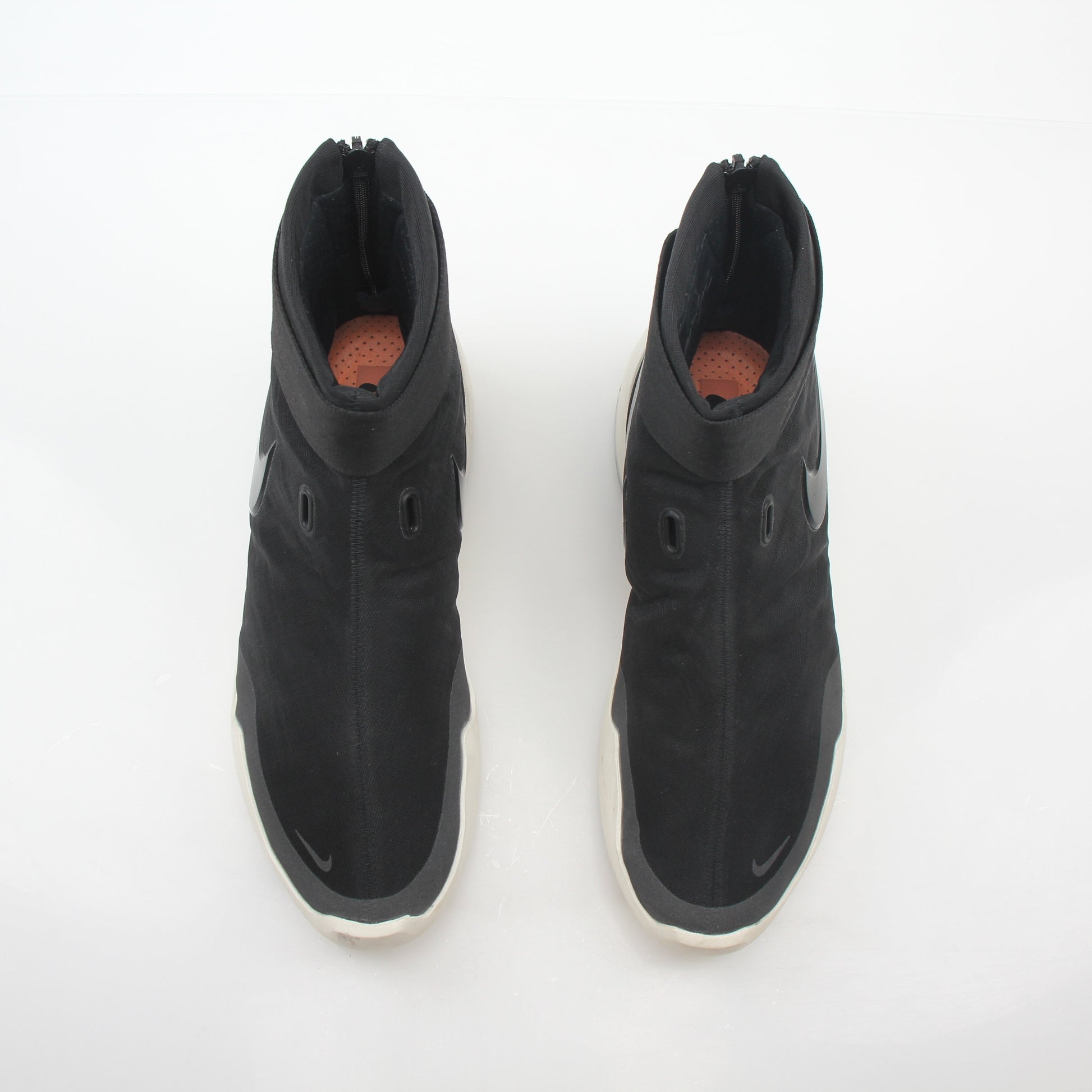 Nike x Fear of God Black Air Fear of God 1 high-top sneakers, black leather shoes with Nike branding and high-top design.