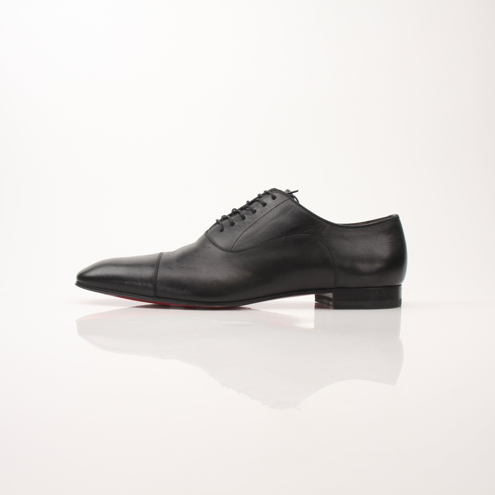 Christian Louboutin Greggo Oxford shoes for men, stylish black leather shoes with sleek design from Gold & Beyond.