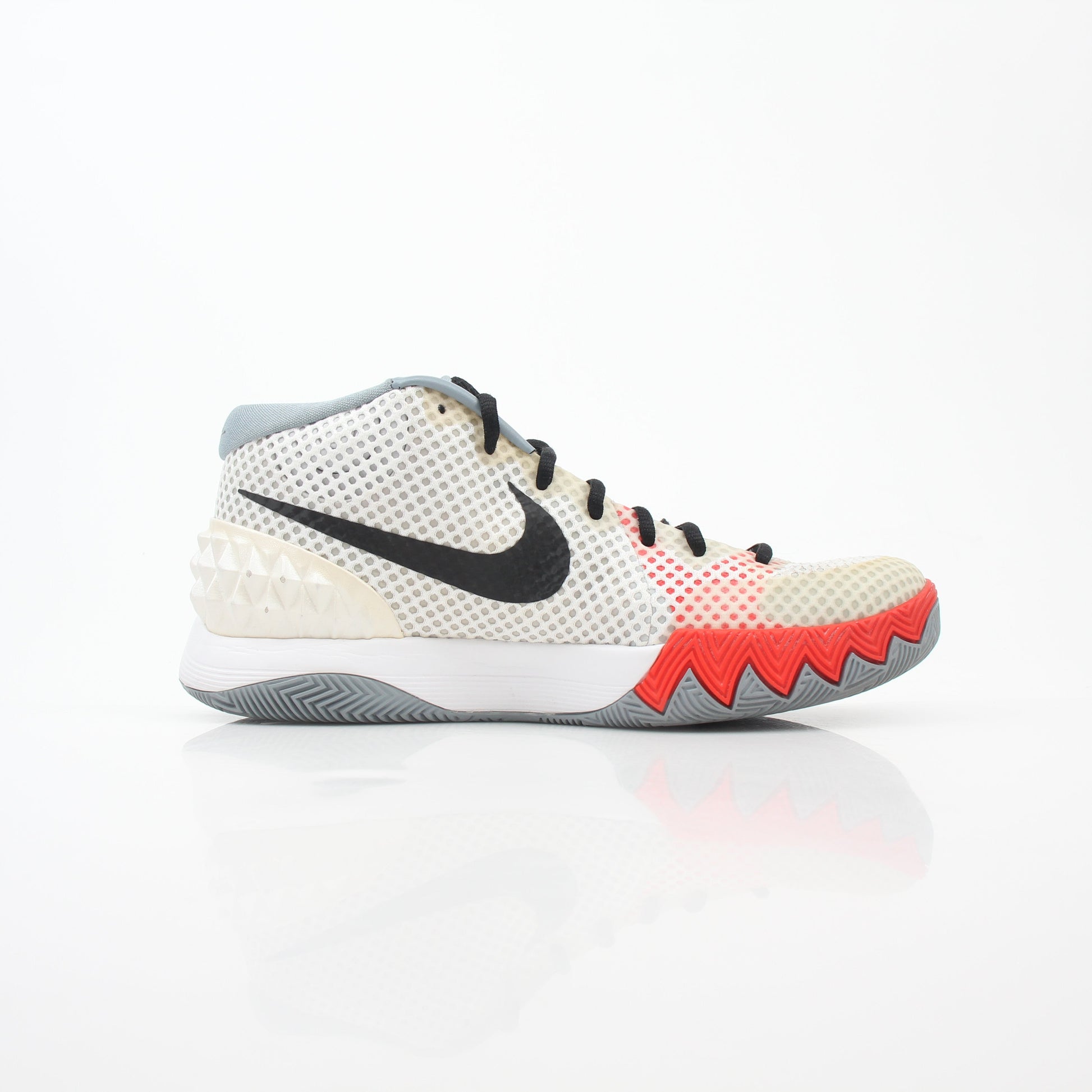 Nike Kyrie 1 Dream White basketball sneakers, gold and black accents, showcasing the stylish design and athletic build.