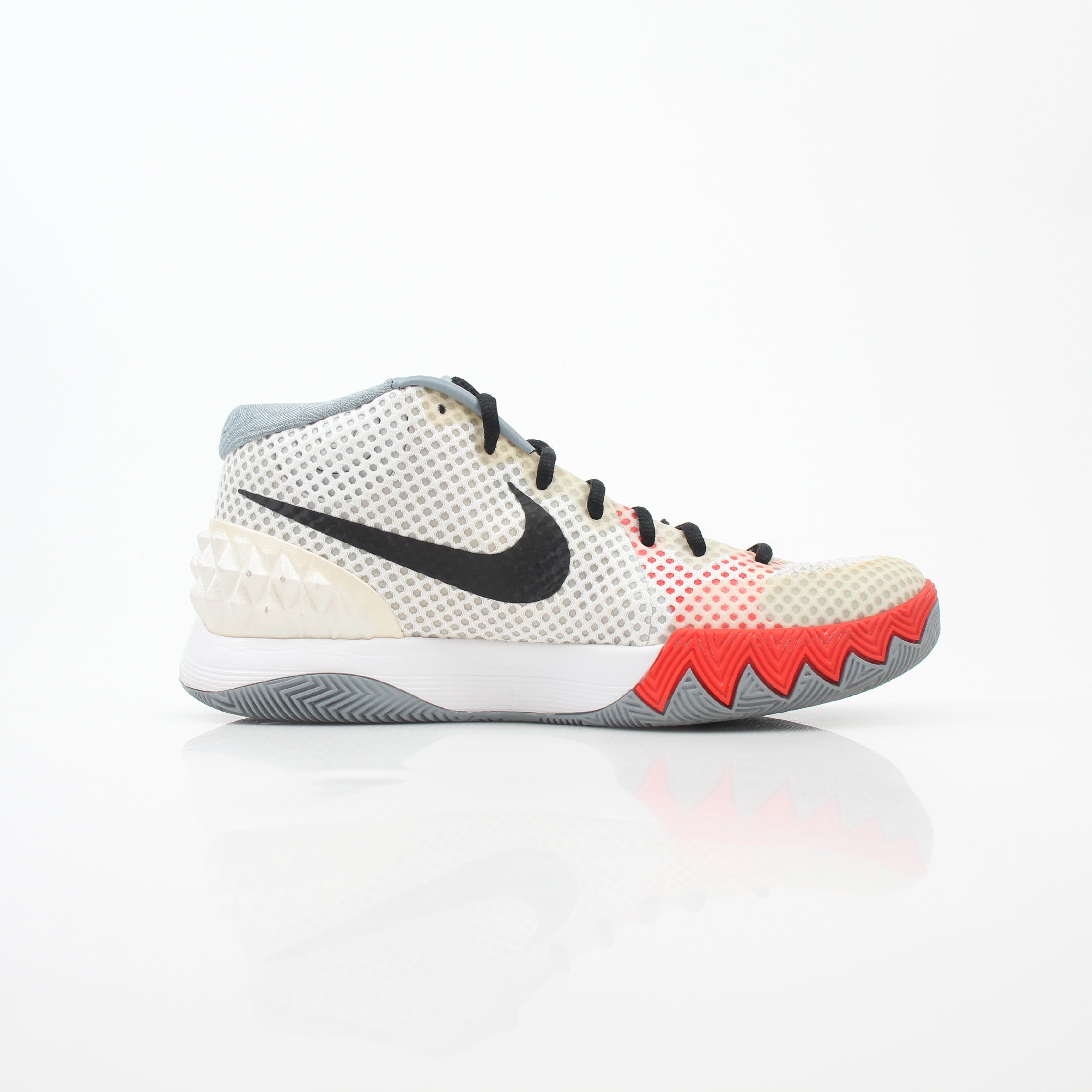 Nike Kyrie 1 Dream White basketball sneakers, gold and black accents, showcasing the stylish design and athletic build.