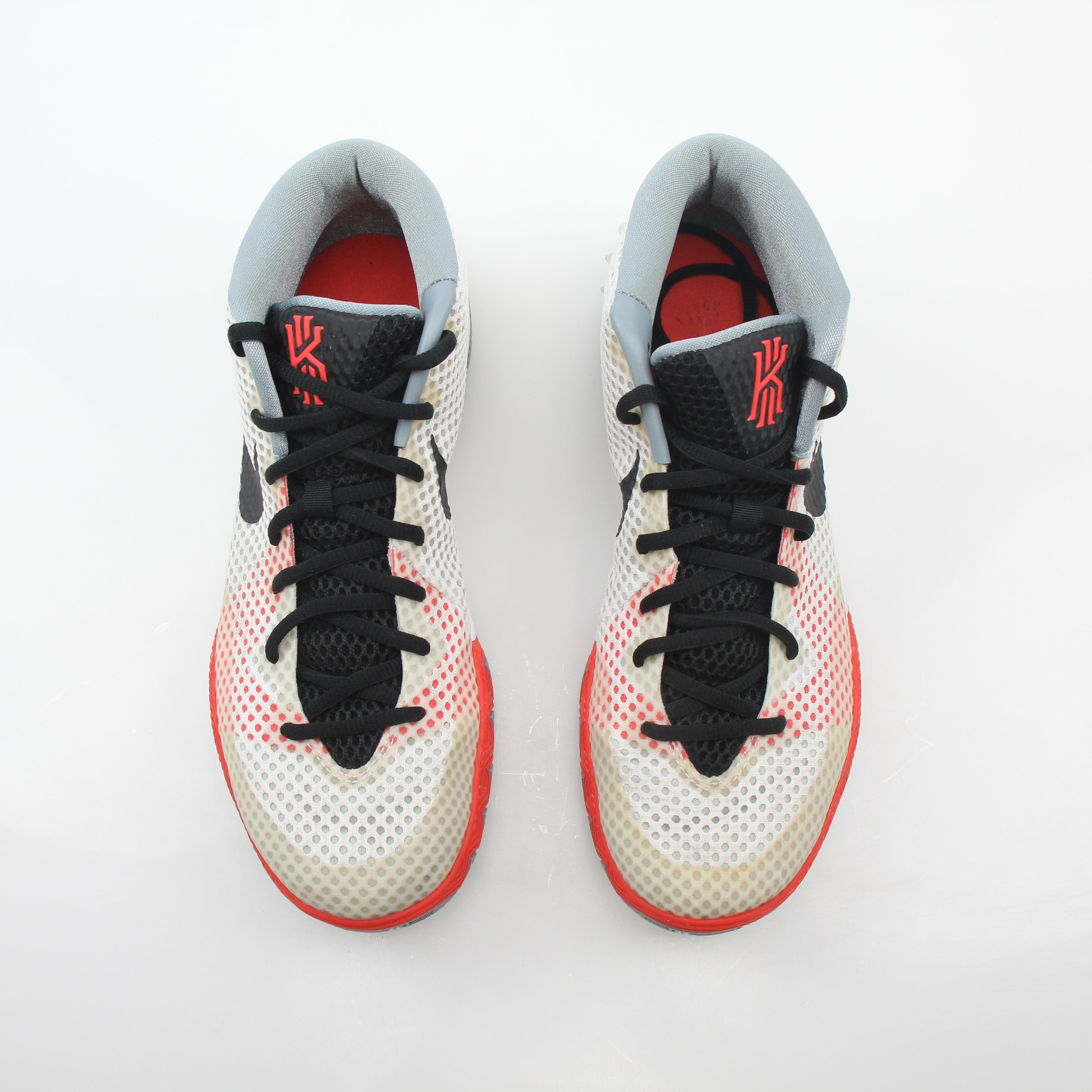 Nike Kyrie 1 Dream White basketball sneakers with white and black design, featuring Nike branding and athletic shoe details.