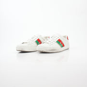 White Gucci Ace sneakers with interlocking G web leather detail, featuring classic design and brand logo on the side.