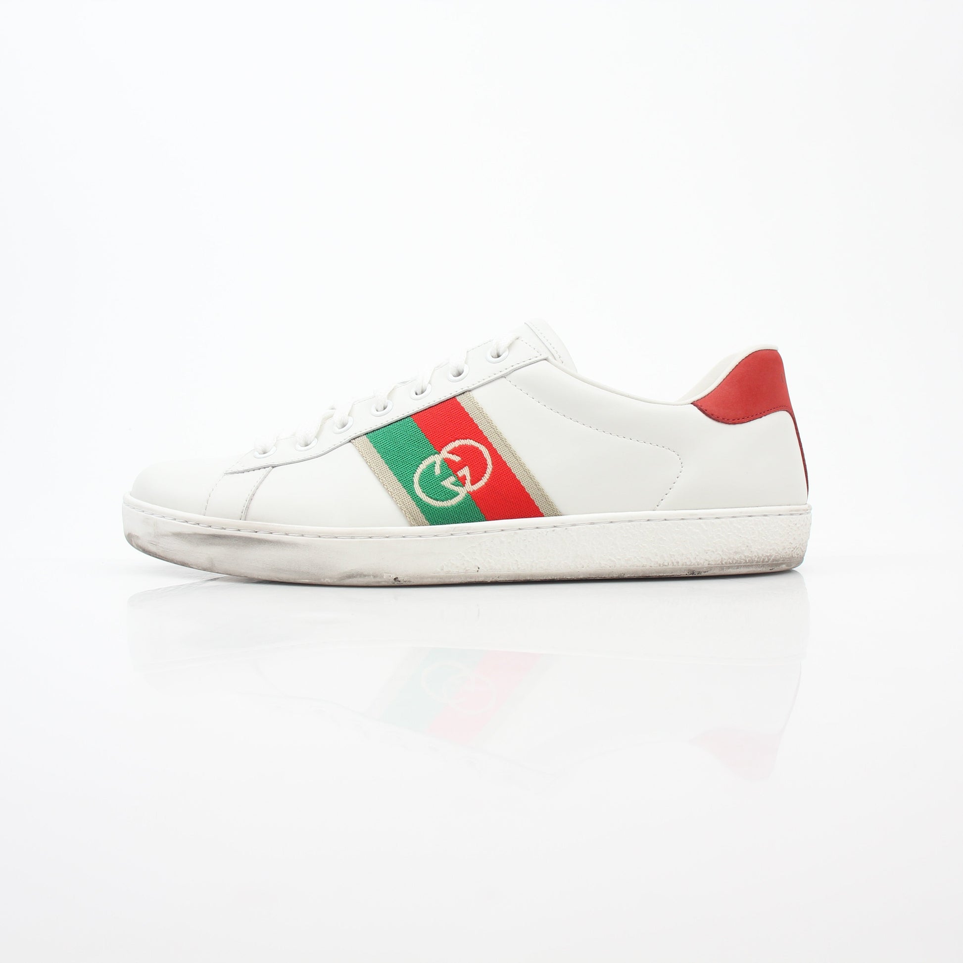 Gucci White Ace sneakers with interlocking G web leather design, casual footwear with sleek style and signature branding.