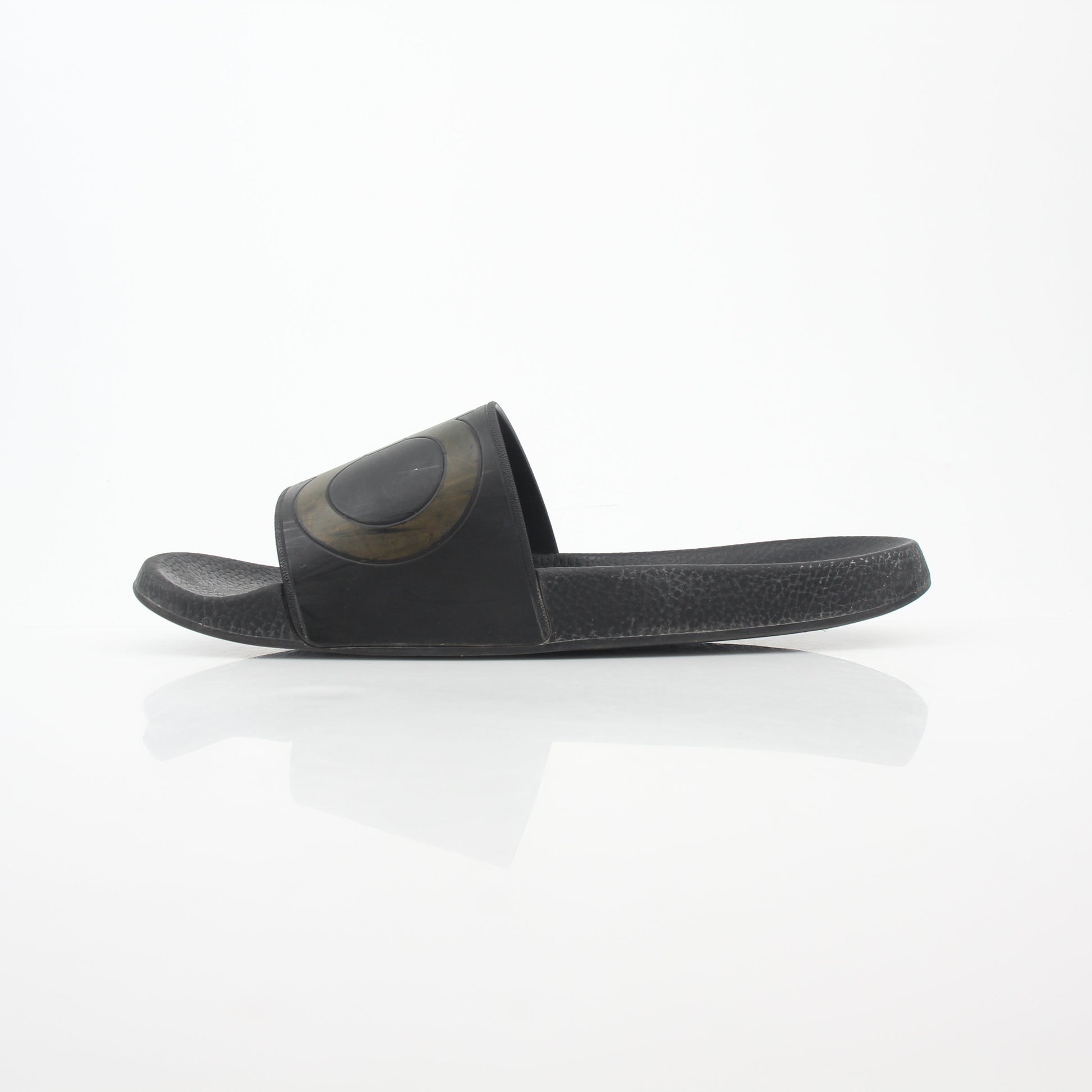 Black Salvatore Ferragamo Groove 2 Gancini slide sandals with signature Gancini detail and sleek design, displayed on a neutral background.