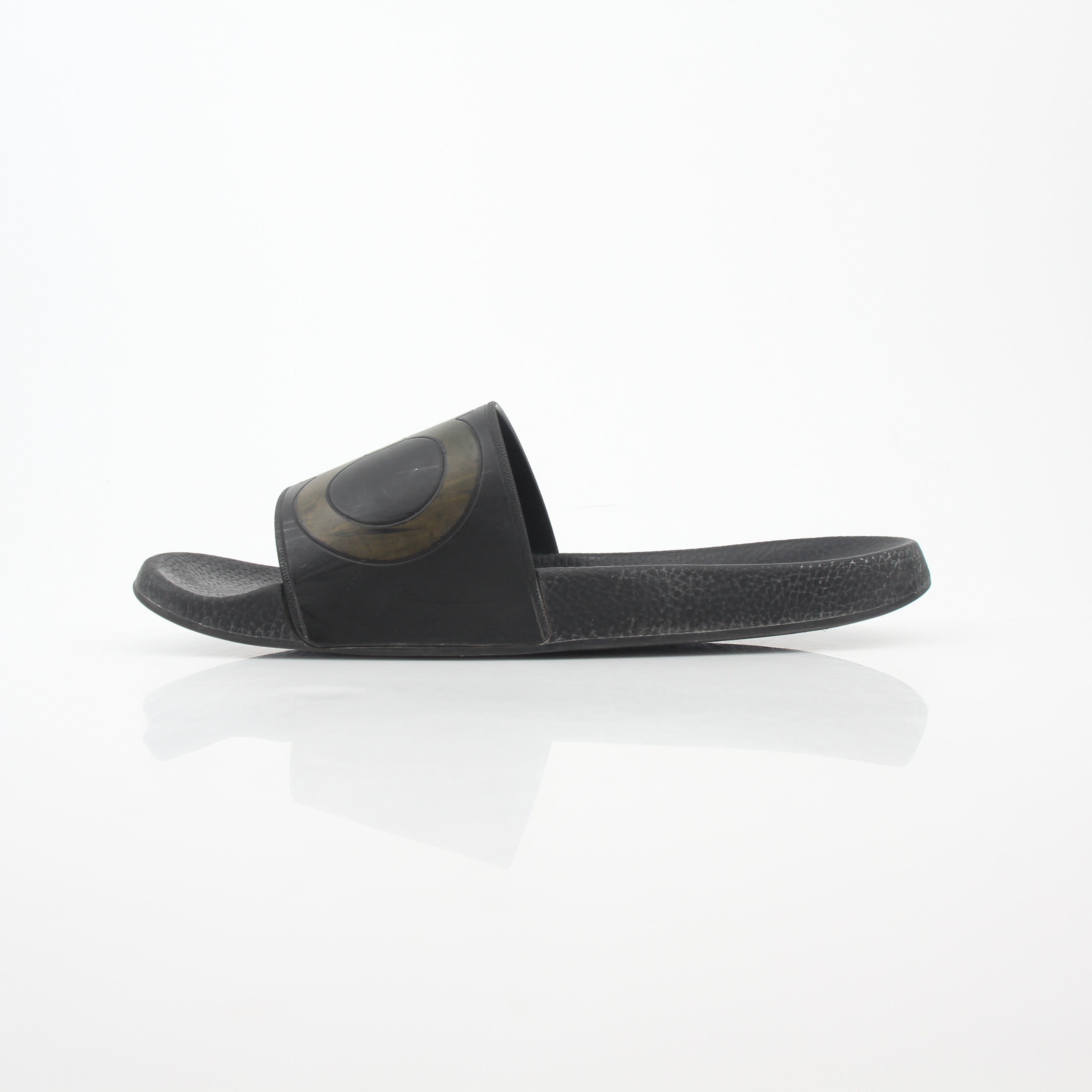 Black Salvatore Ferragamo Groove 2 Gancini slide sandals with signature Gancini detail and sleek design, displayed on a neutral background.