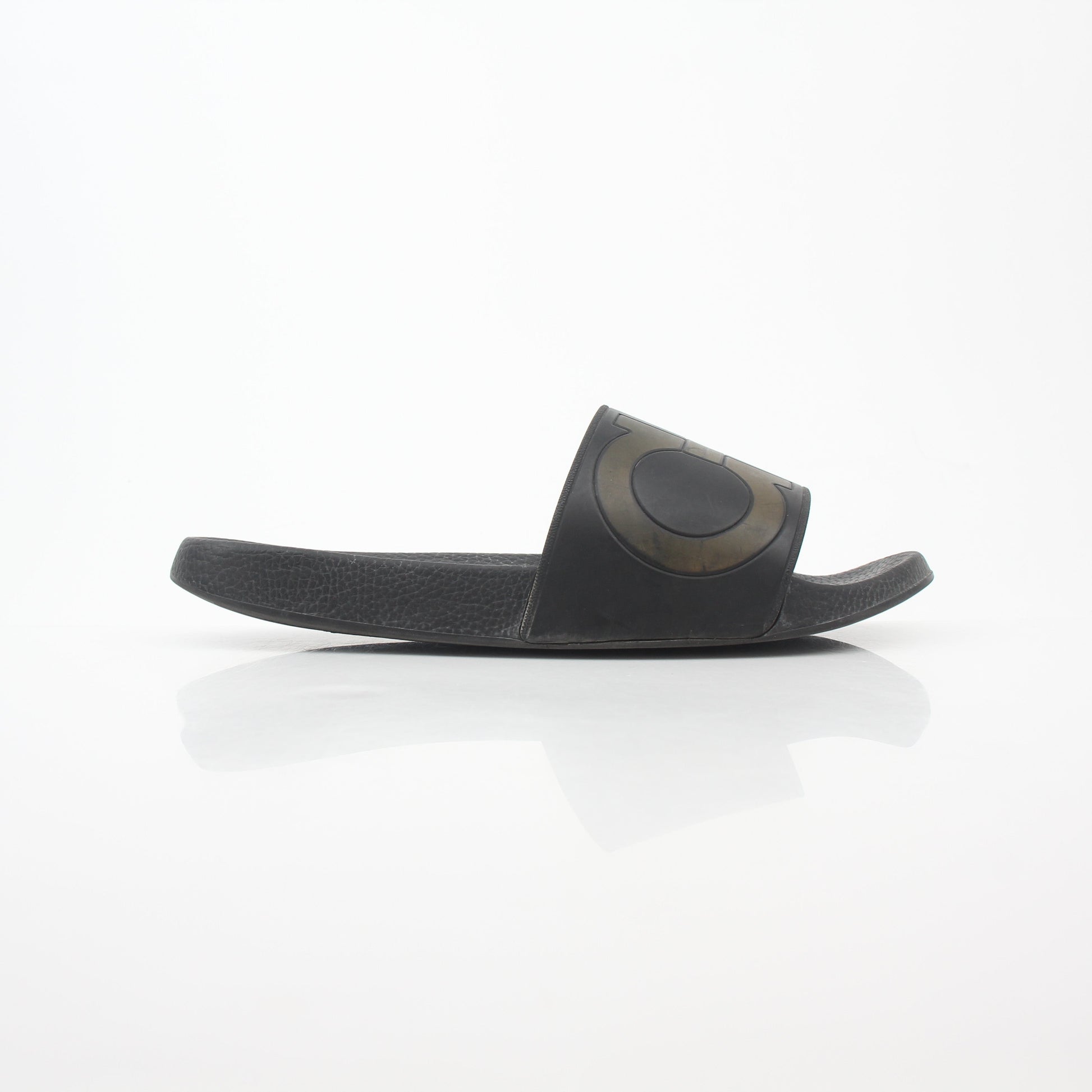 Black Salvatore Ferragamo Groove 2 Gancini slide sandals with leather straps and Gancini hardware, displayed on a neutral background.