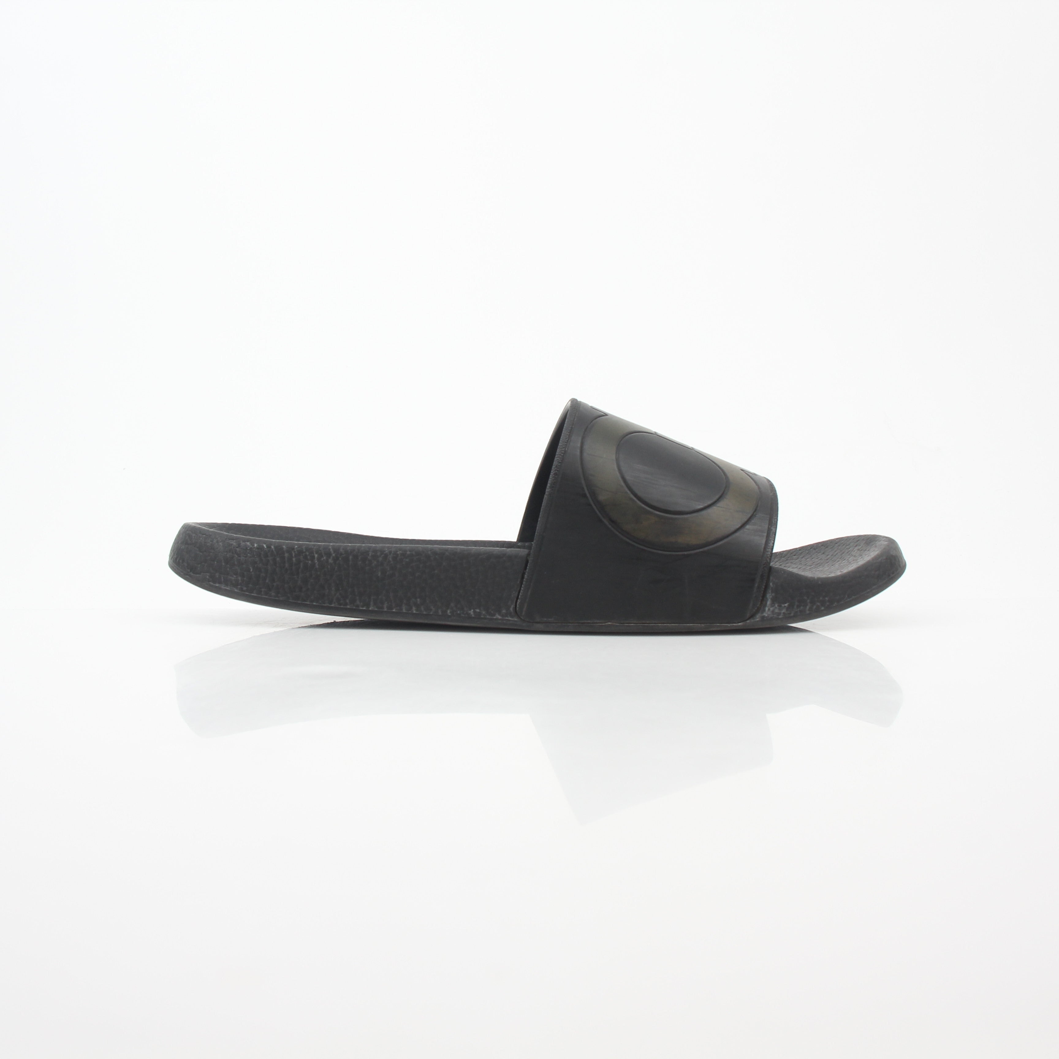 Black Salvatore Ferragamo Groove 2 Gancini slide sandals with gold accents, featuring sleek leather straps and a comfortable sole.