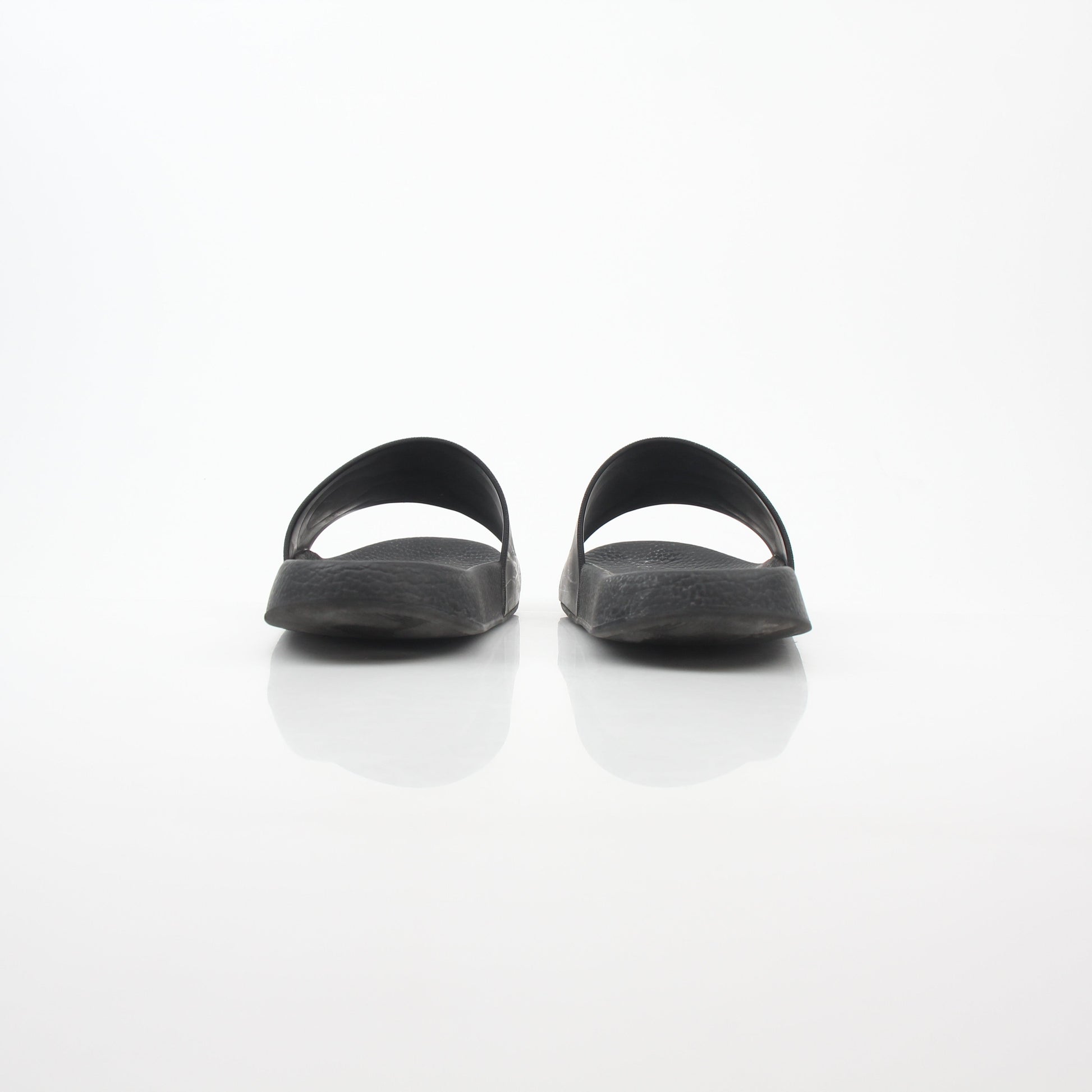 Salvatore Ferragamo Black Groove 2 Gancini slide sandals with black straps and Gancini buckle detail on stylish footwear.