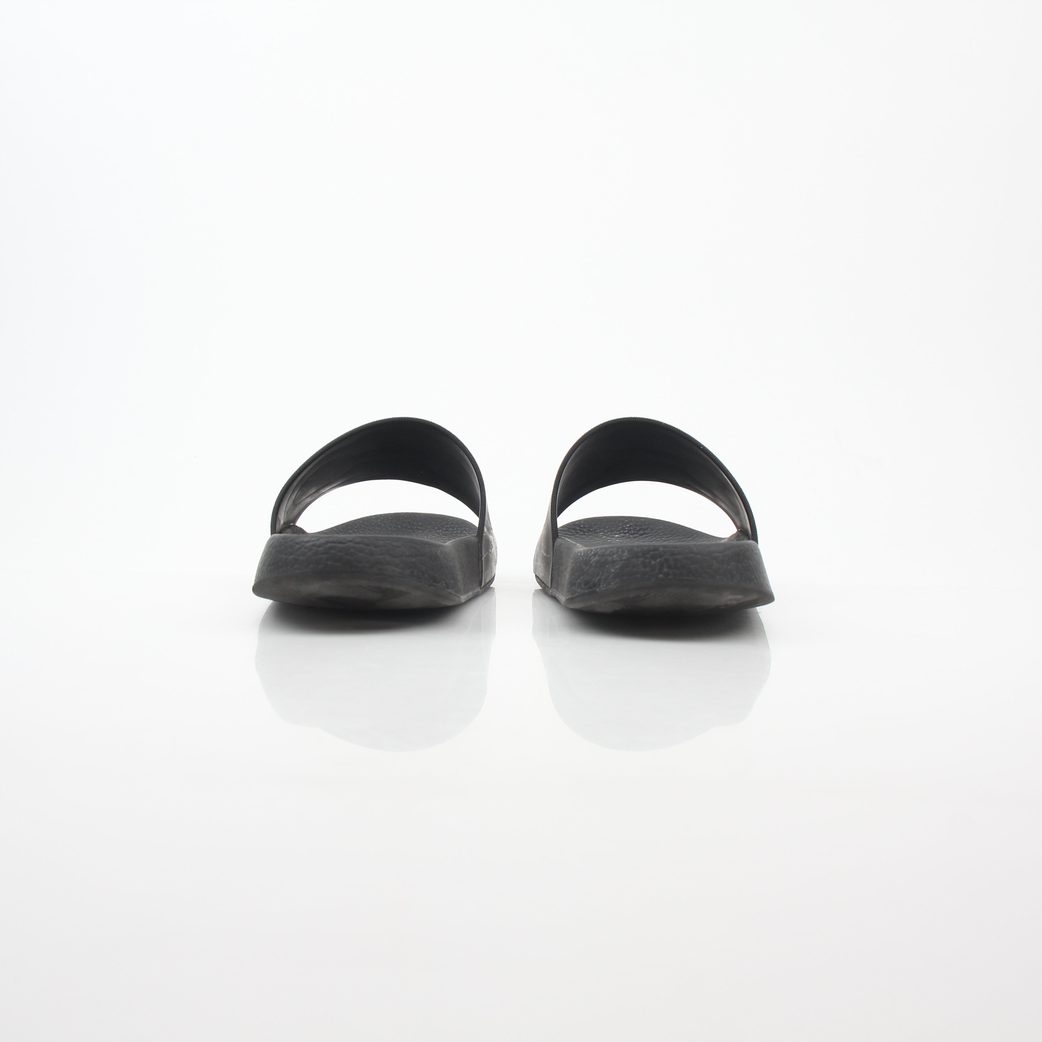 Salvatore Ferragamo Black Groove 2 Gancini slide sandals with black straps and Gancini buckle detail on stylish footwear.