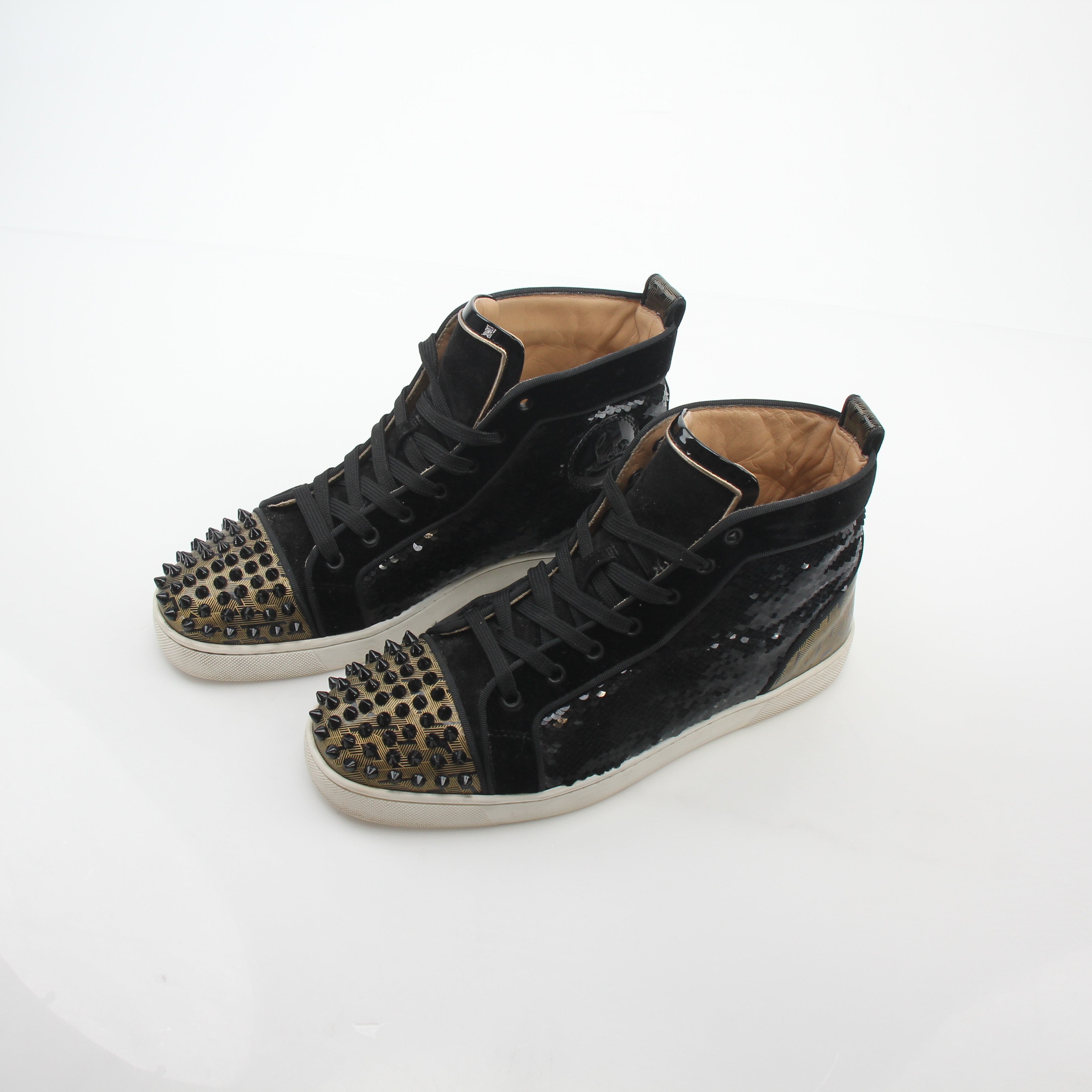 Black Christian Louboutin Lou Spikes Orlato high-top sneakers with spikes and edgy design, by Gold & Beyond.