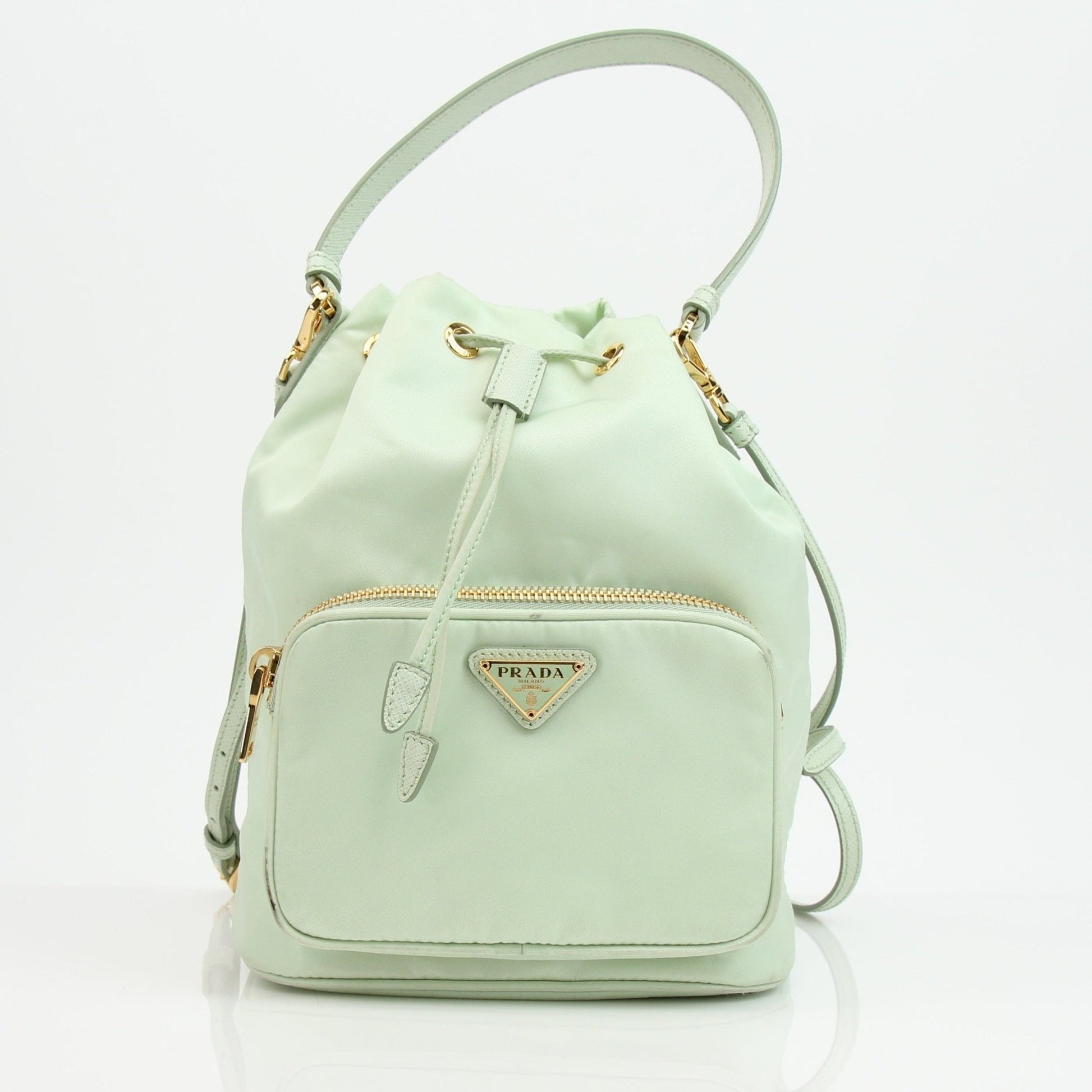 Prada nylon drawstring handbag with adjustable straps and front logo, stylish and functional for everyday use.