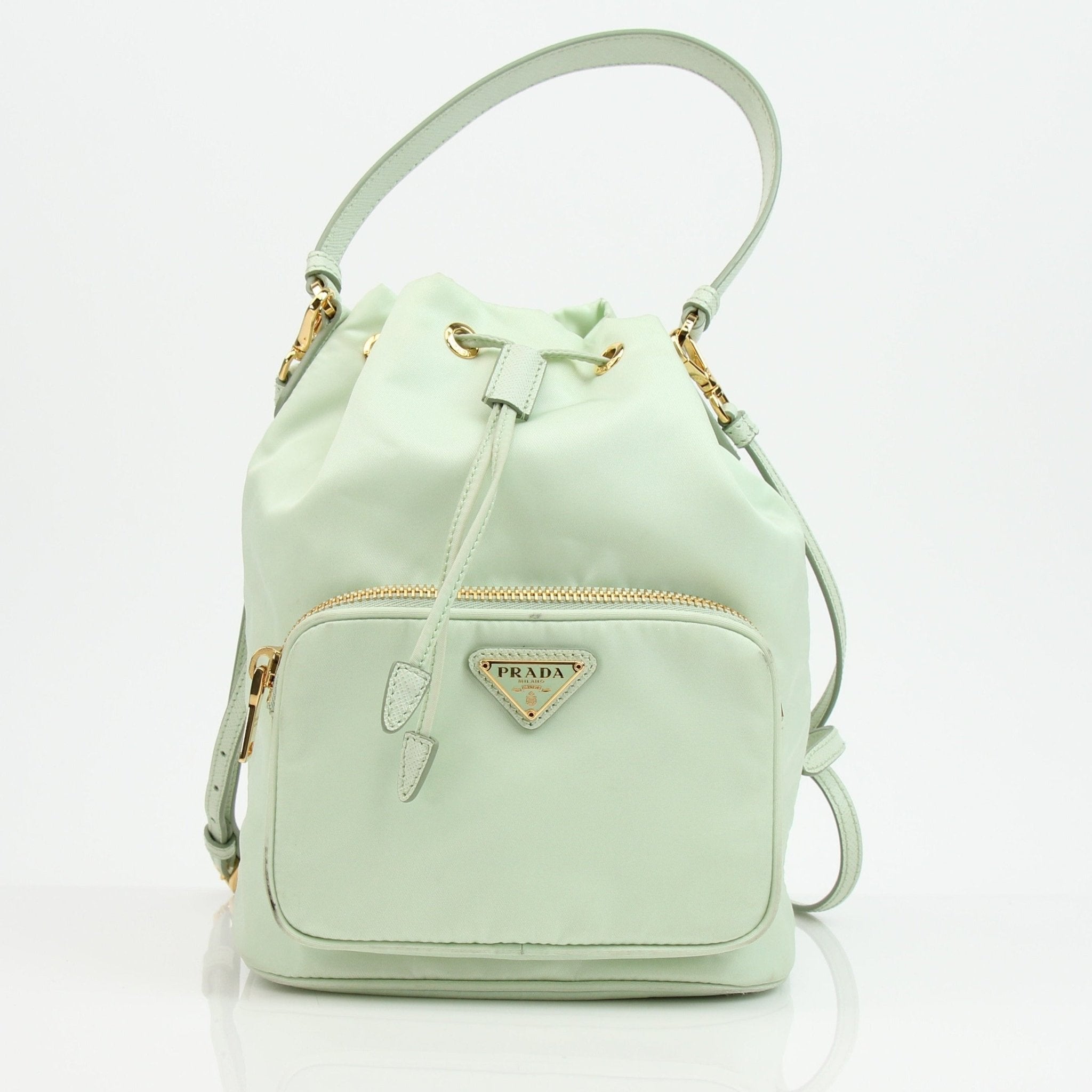 Prada nylon drawstring handbag with adjustable straps and front logo, stylish and functional for everyday use.