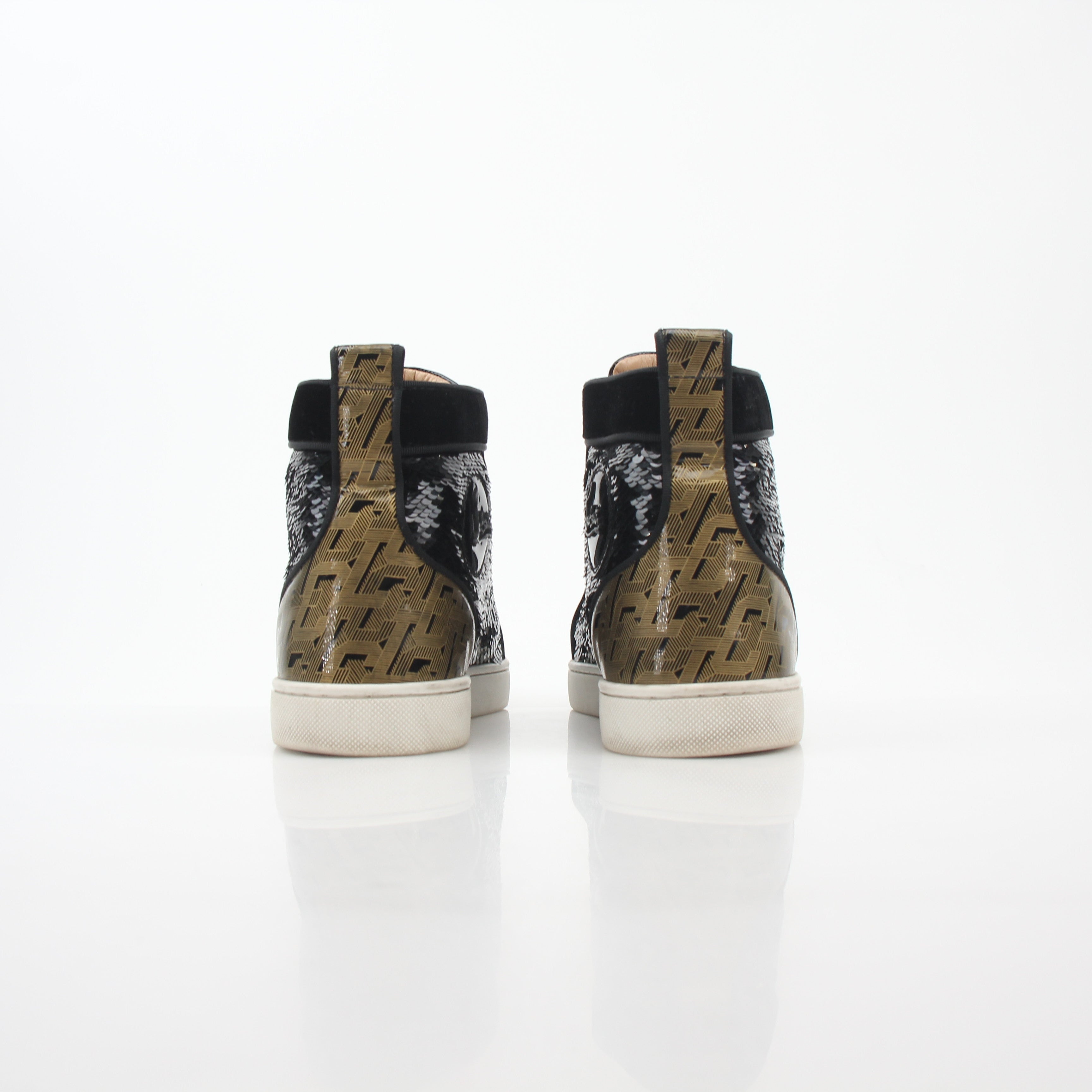 Christian Louboutin Lou Spikes Orlato high-top sneakers in black with spikes, featuring a sleek leather design and signature style.