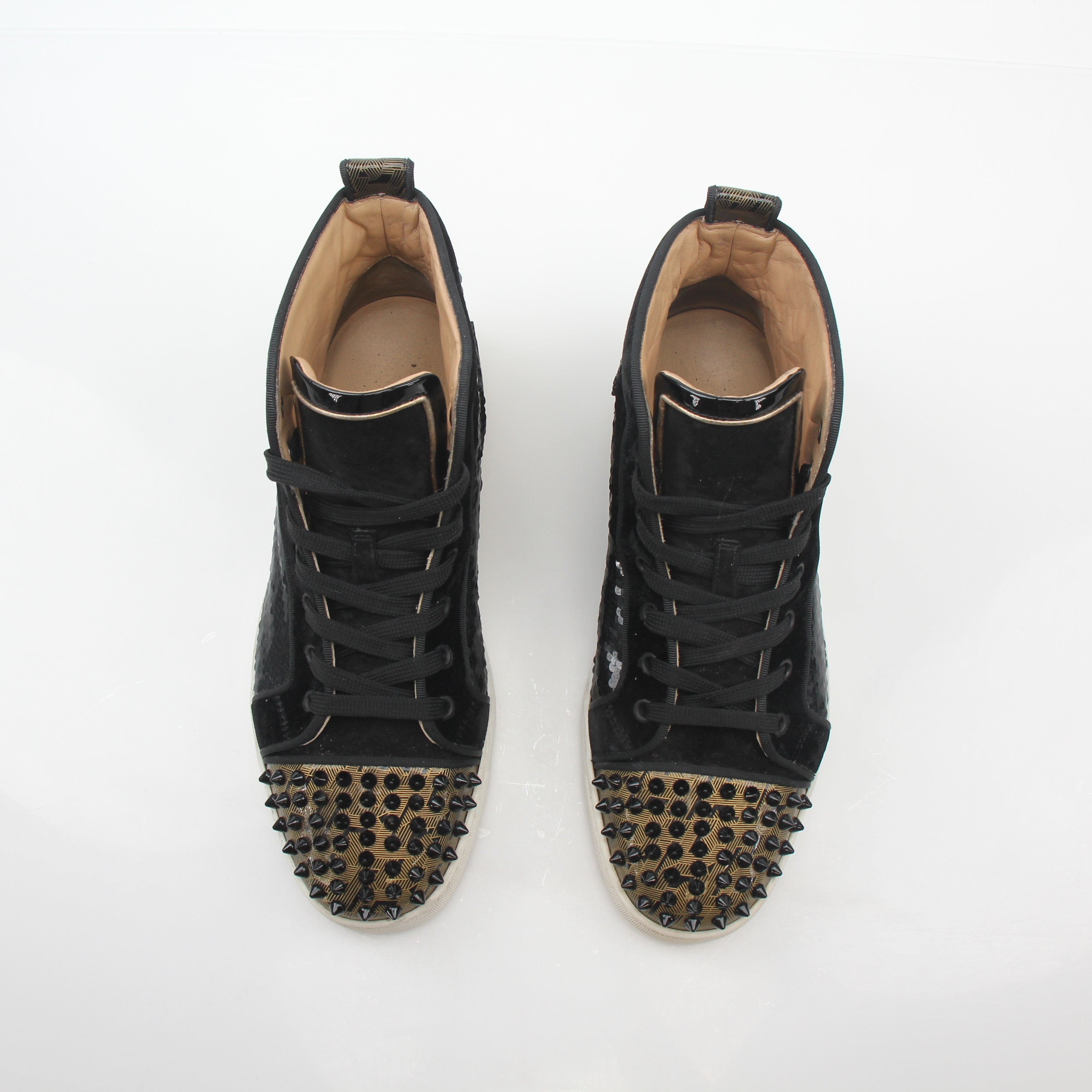 Christian Louboutin Lou Spikes Orlato high-top sneakers in black with red sole and spike details, displayed on a white background.