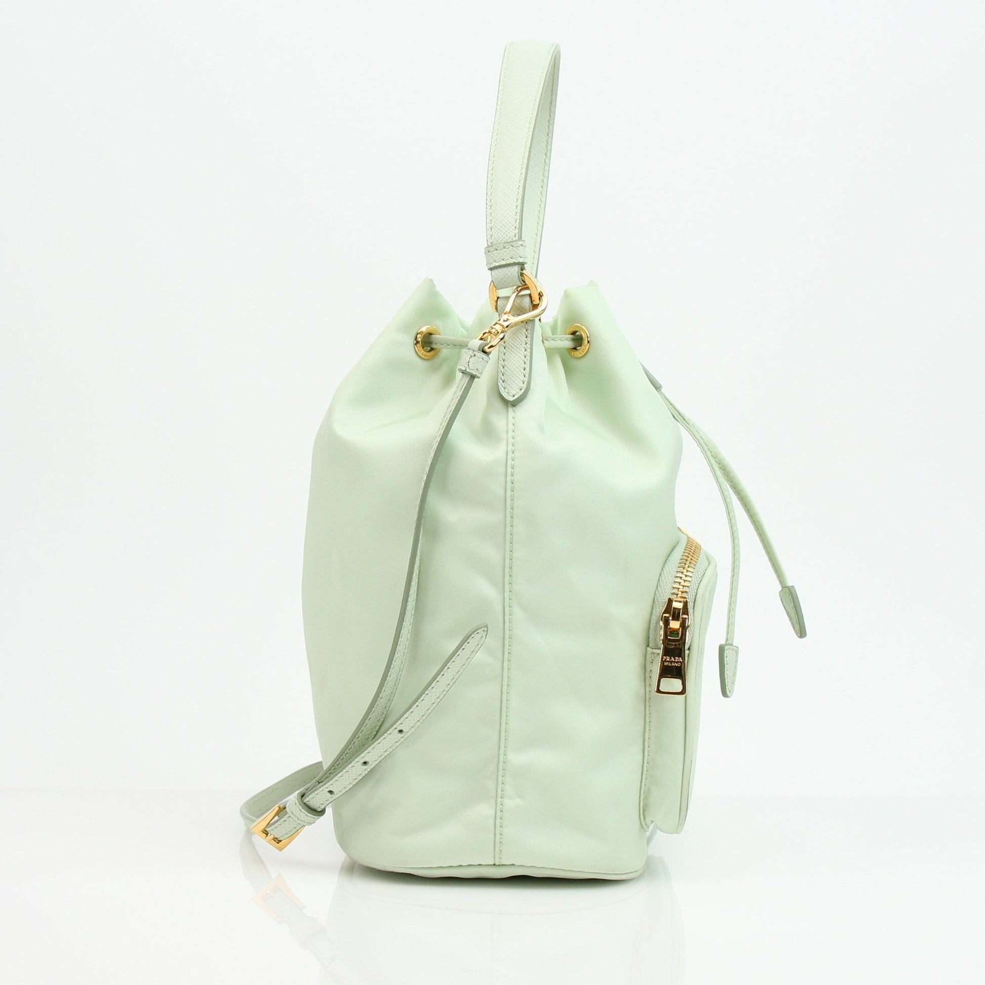 Prada nylon drawstring handbag with adjustable straps and sleek design, featuring the Prada logo on the front.