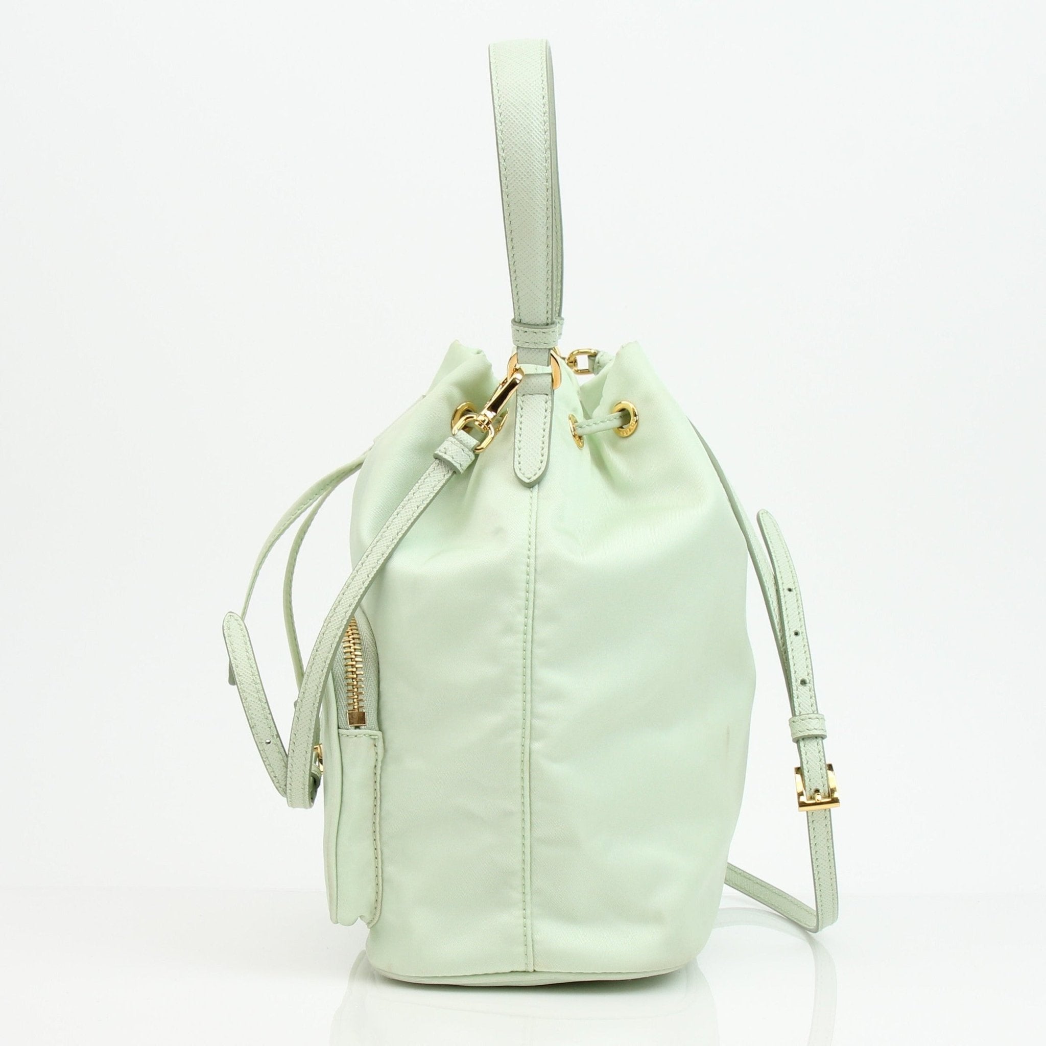 Prada nylon drawstring handbag with adjustable straps and sleek design, featuring the iconic Prada logo on the front.