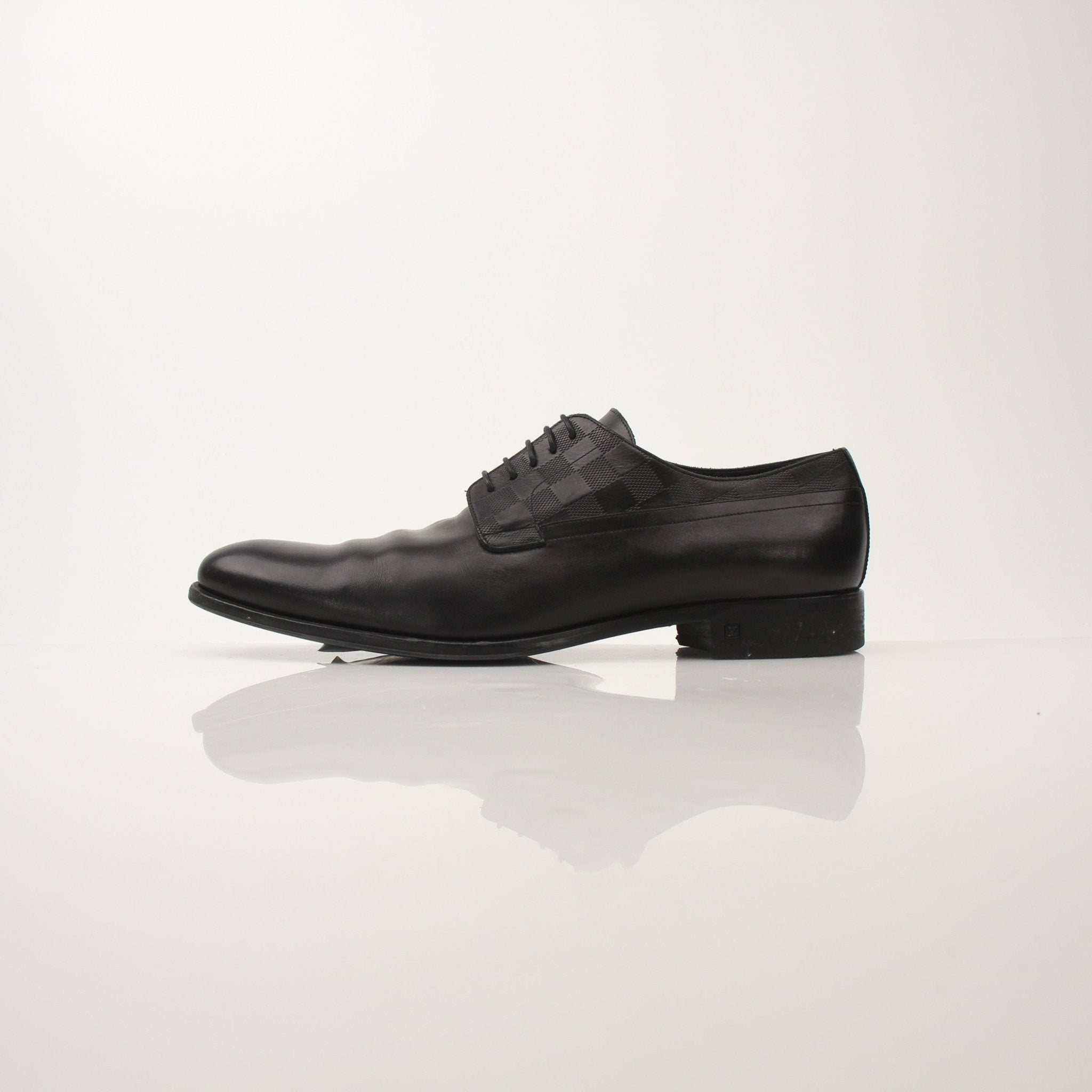 Gold & Beyond Louis Vuitton Men’s Haussmann Derby Shoes, close-up of classic leather dress shoes with detailed stitching.