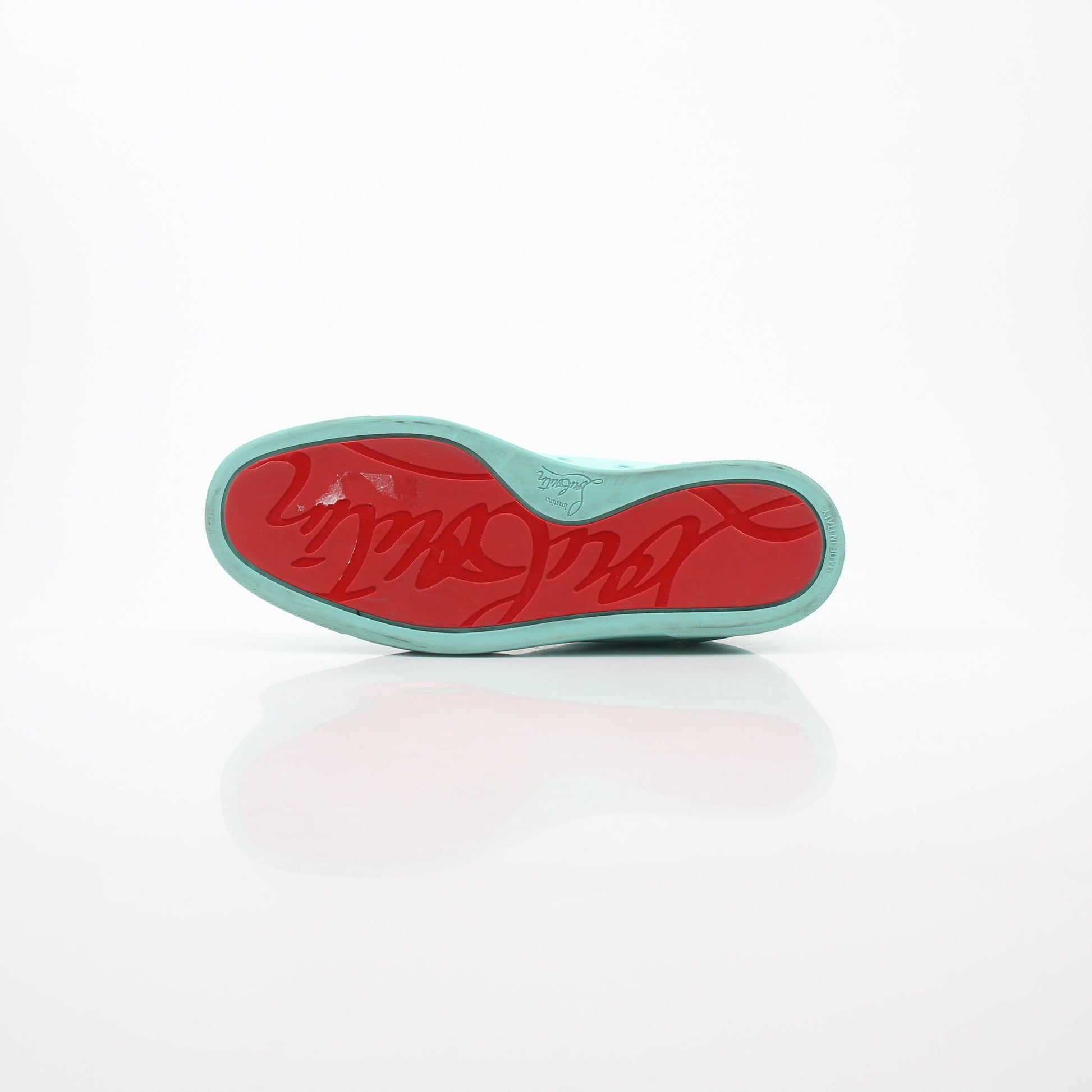 Christian Louboutin Turquoise Rantulow Orlato low-top sneakers with signature red sole and stylish design, featured in a product image.