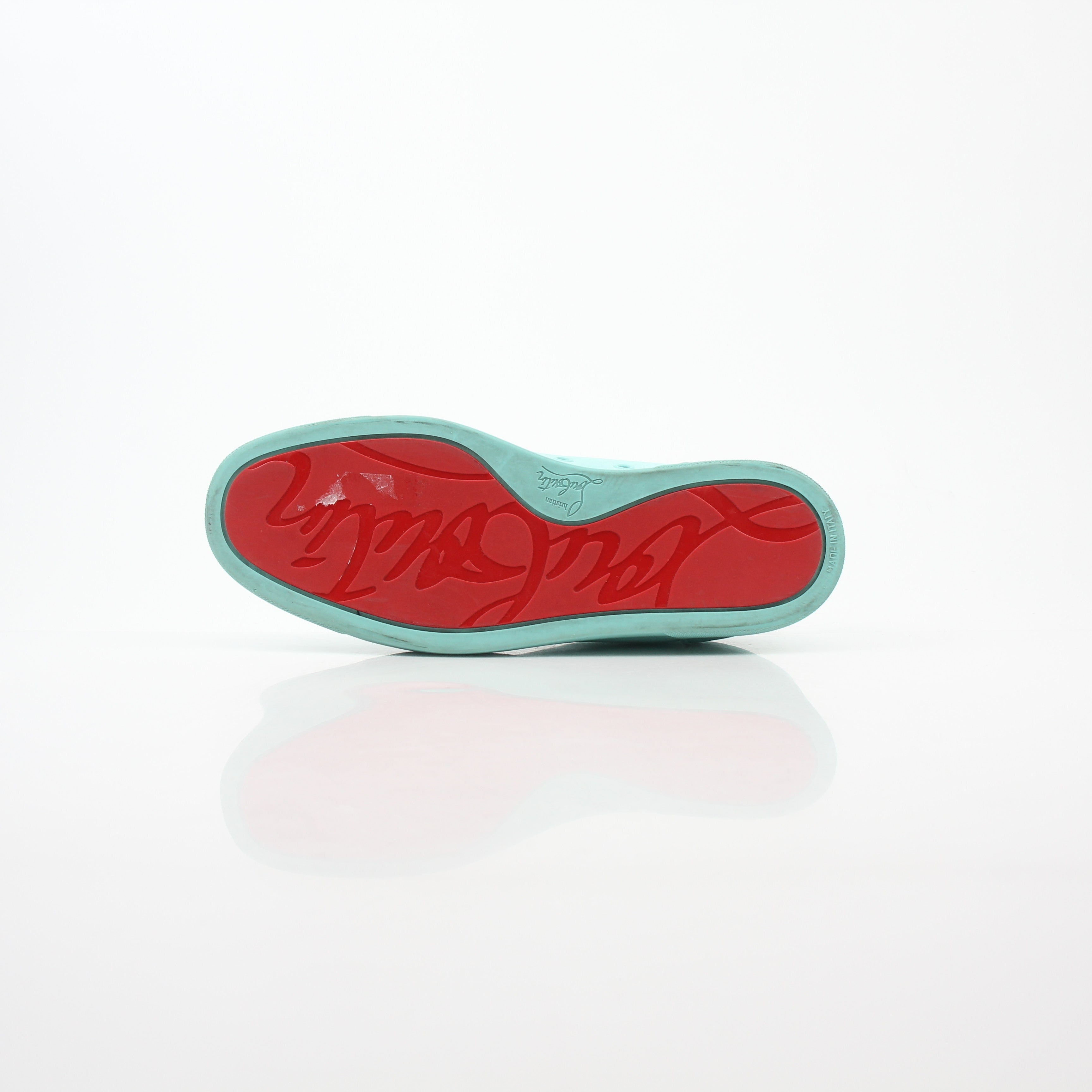 Christian Louboutin Turquoise Rantulow Orlato low-top sneakers with signature red sole and stylish design, featured in a product image.