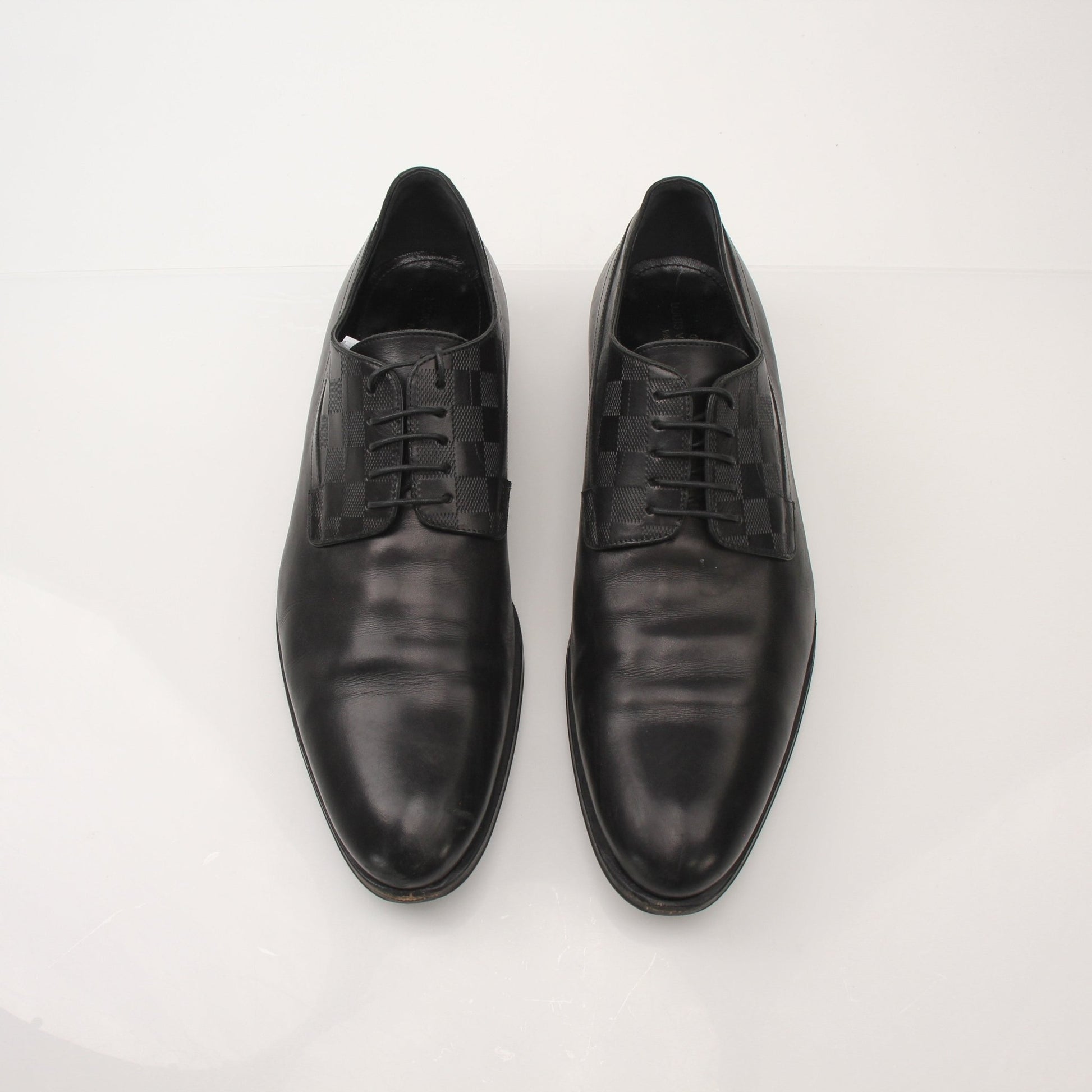 Louis Vuitton Men’s Haussmann Derby Shoes, black leather dress shoes with sleek design and lace-up closure from Gold & Beyond.