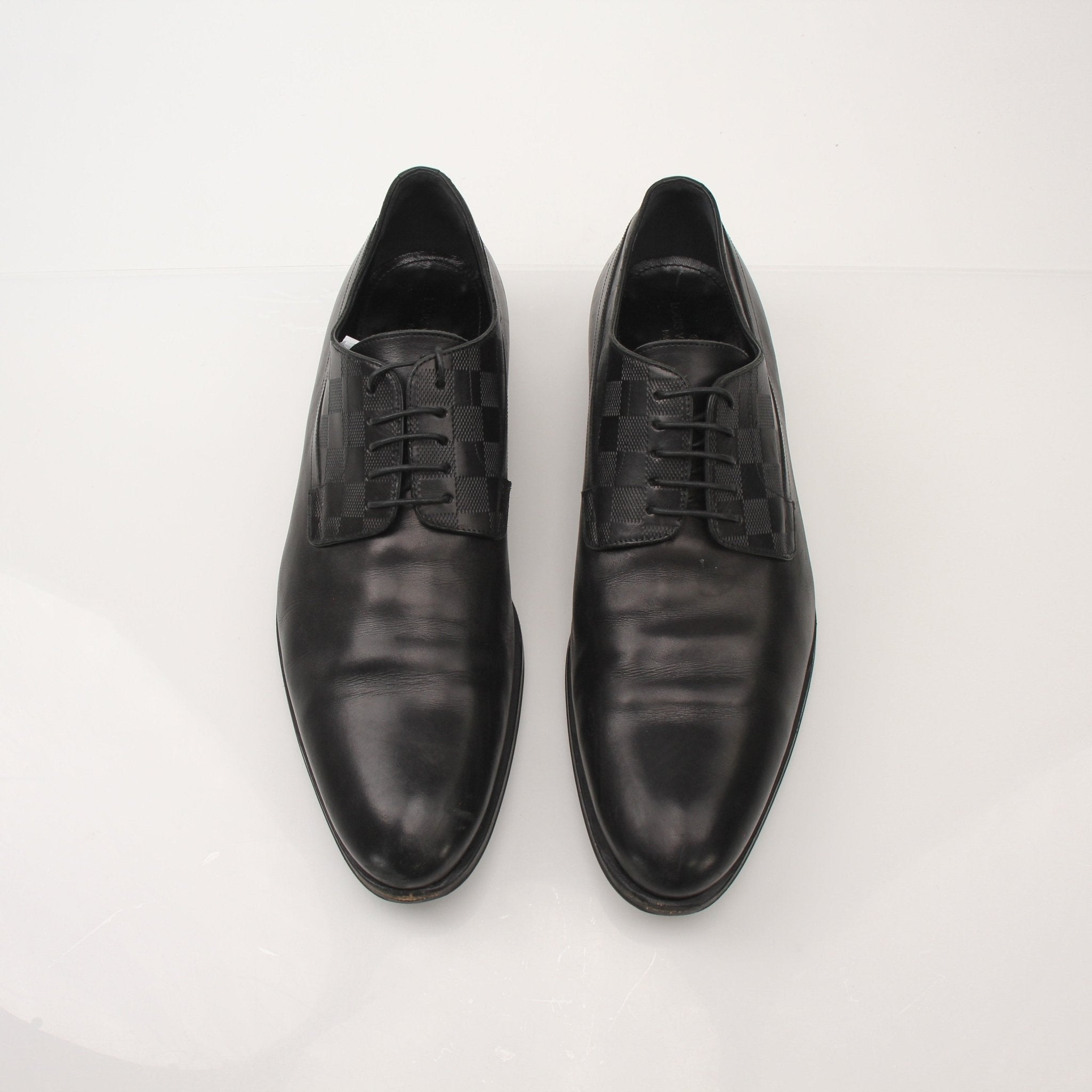 Louis Vuitton Men’s Haussmann Derby Shoes, black leather dress shoes with sleek design and lace-up closure from Gold & Beyond.
