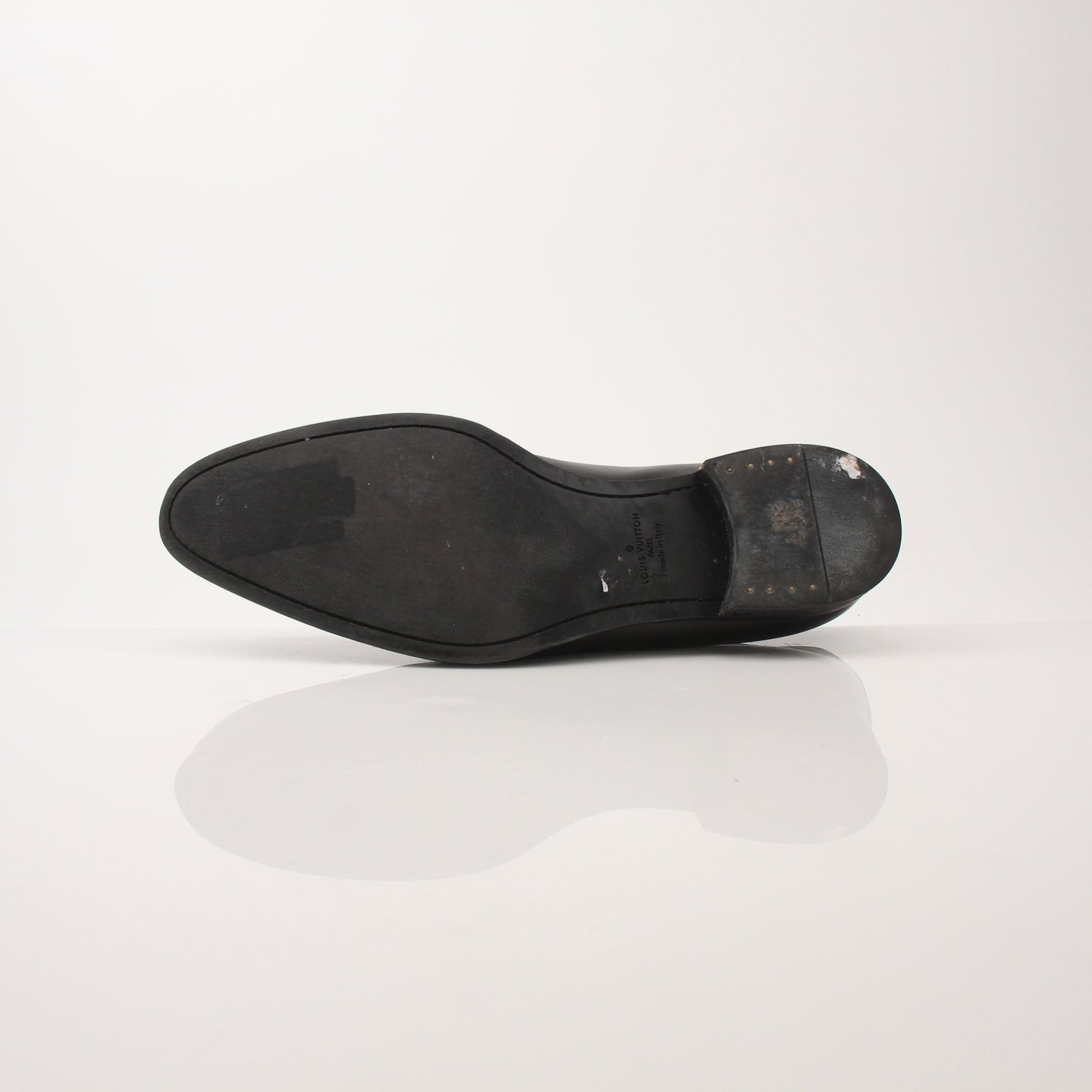 Gold & Beyond Louis Vuitton Men’s Haussmann Derby Shoes, close-up of sleek black leather dress shoes with detailed stitching.