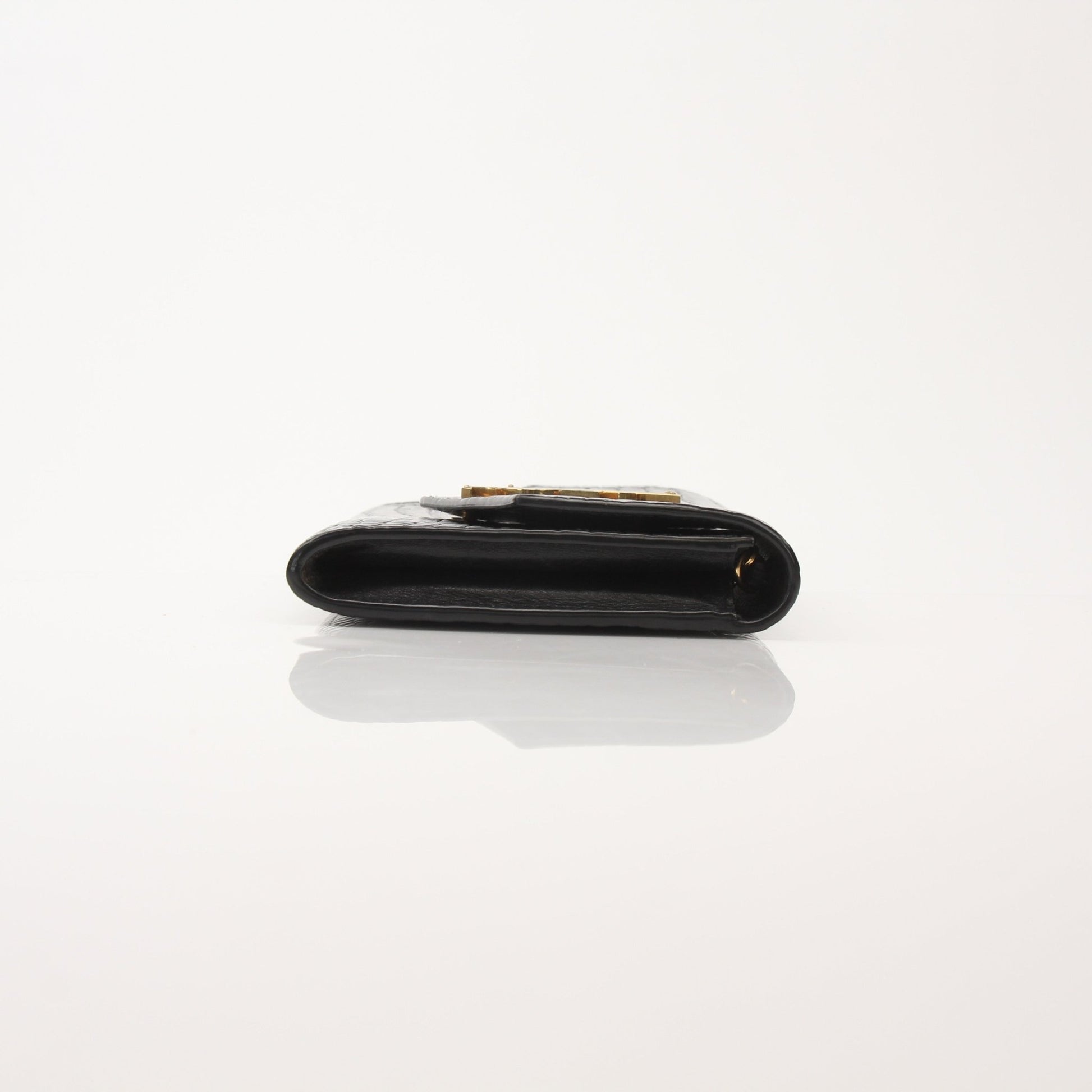 Saint Laurent Uptown Chain Wallet by Gold & Beyond, featuring a sleek design with a chain strap and luxurious leather finish.